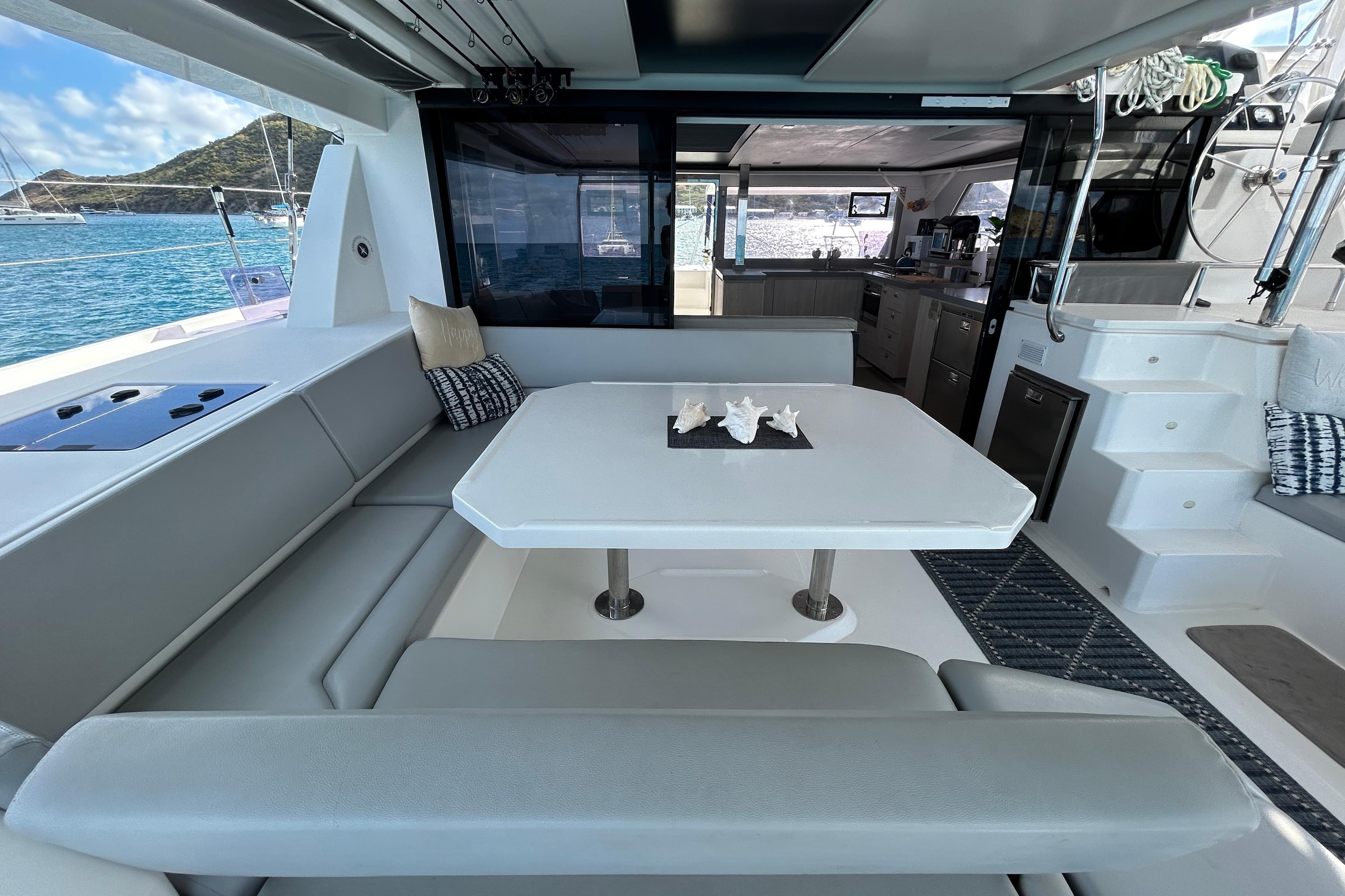 Luxurious 2020 Leopard 45 yacht interior with elegant seating and scenic ocean view.
