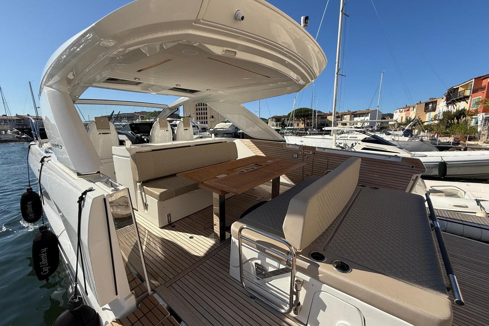 2023 Jeanneau DB/43 IB yacht with spacious deck and seating area in marina.