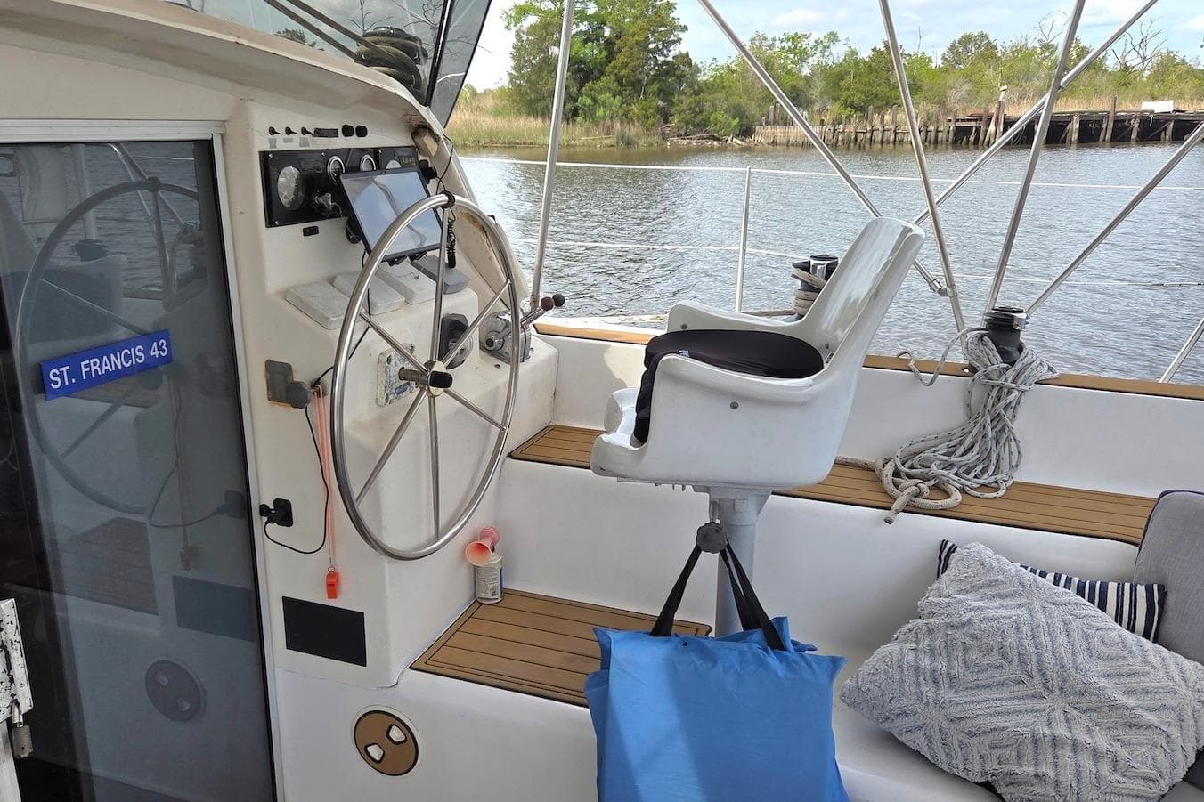Cockpit of 1995 Catamaran St. Francis 43 with steering wheel and captain's chair.