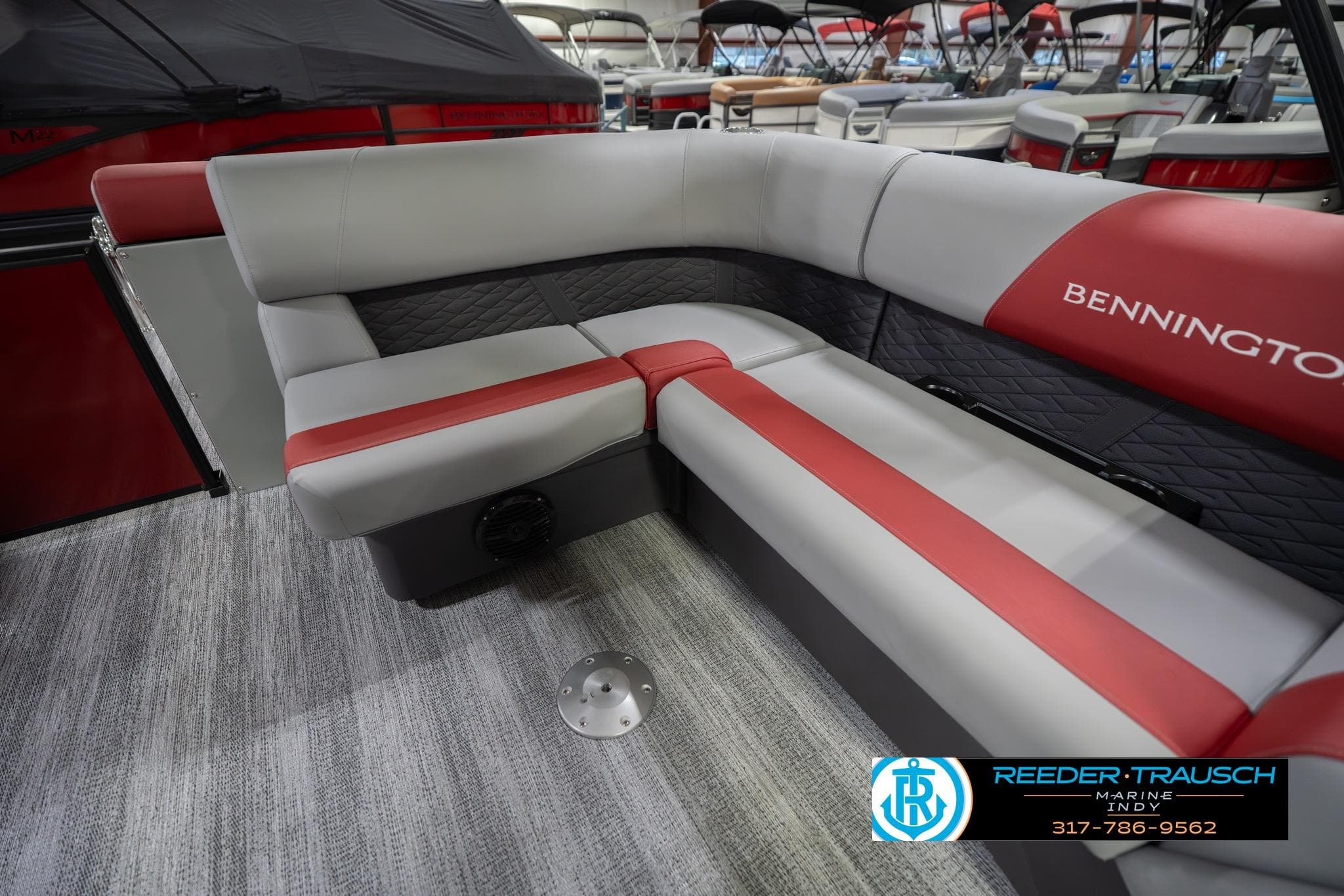 2026 Bennington 22 SLJ boat interior with red and gray seating, showcased at Reeder Trausch Marine.