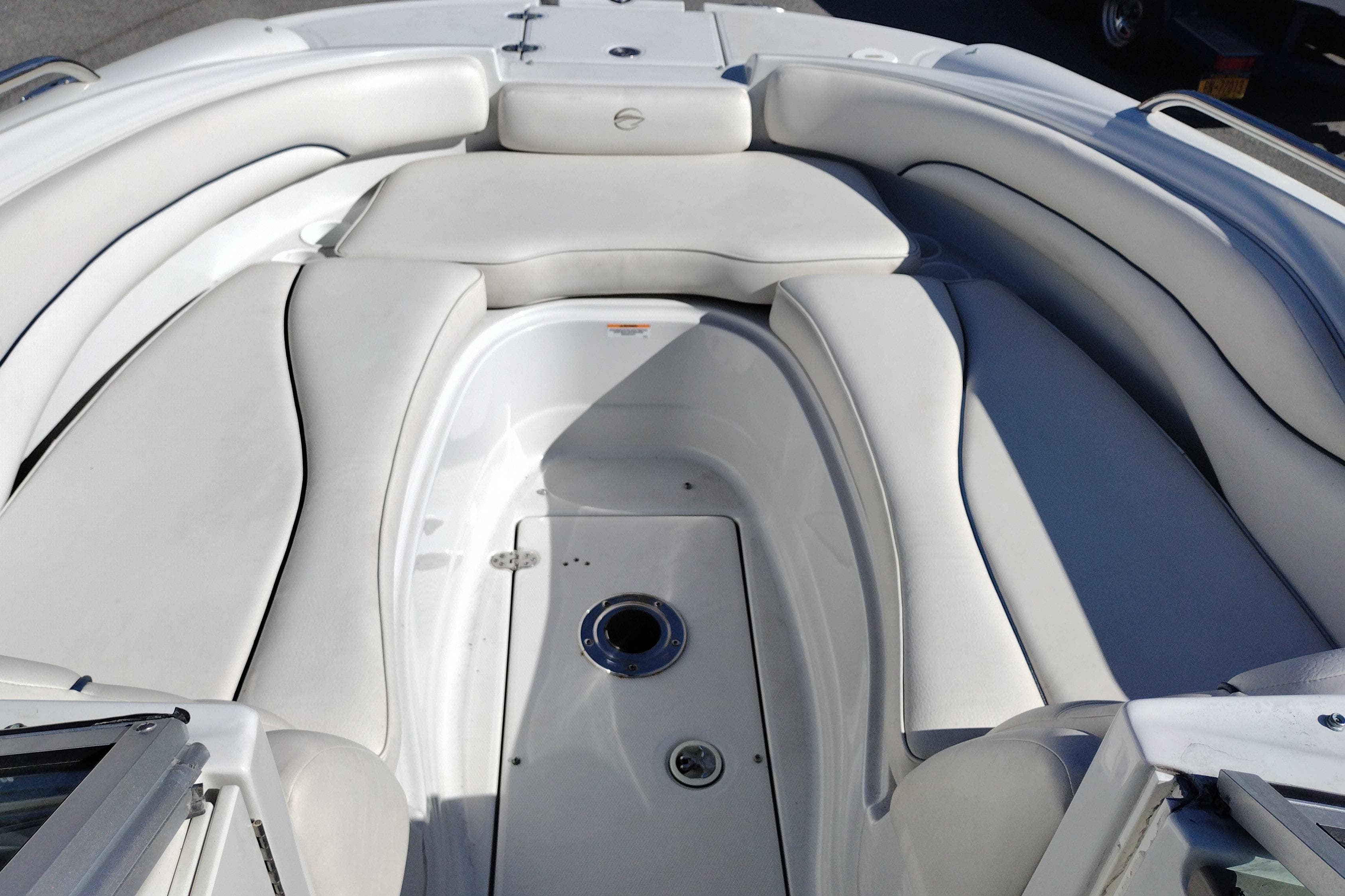2005 Crownline 240 EX boat interior with white cushioned seating.