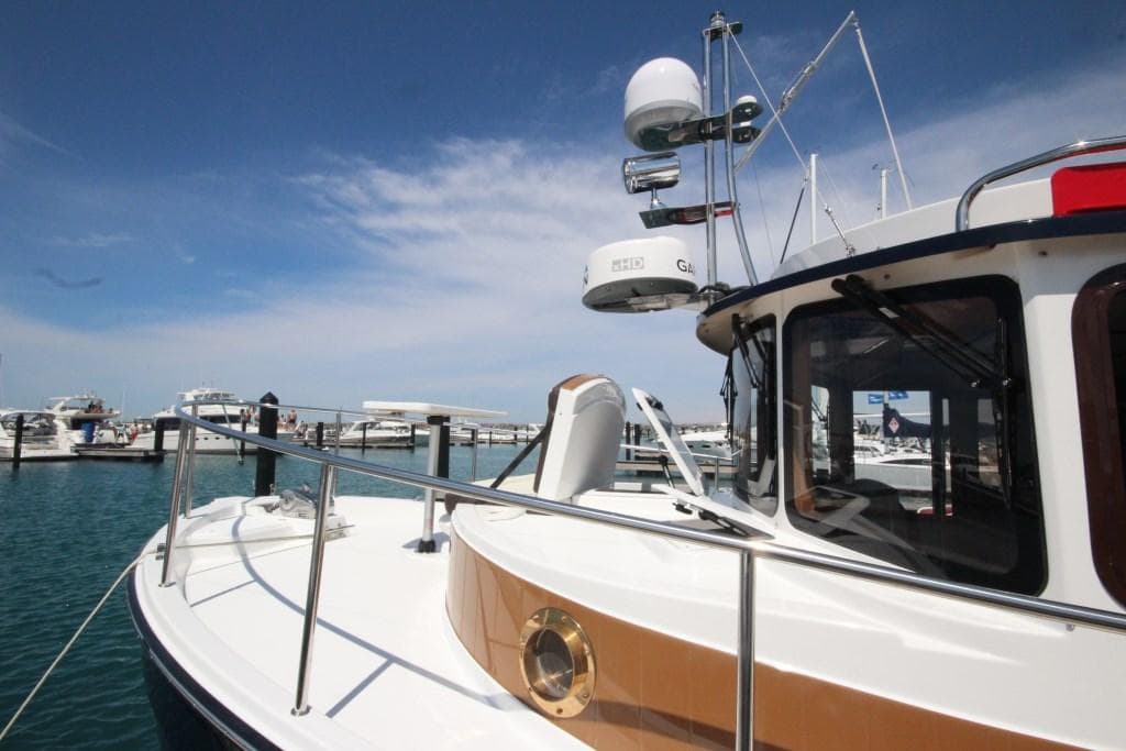 2024 Ranger Tugs R-31 Sedan Luxury Edition docked at a marina.