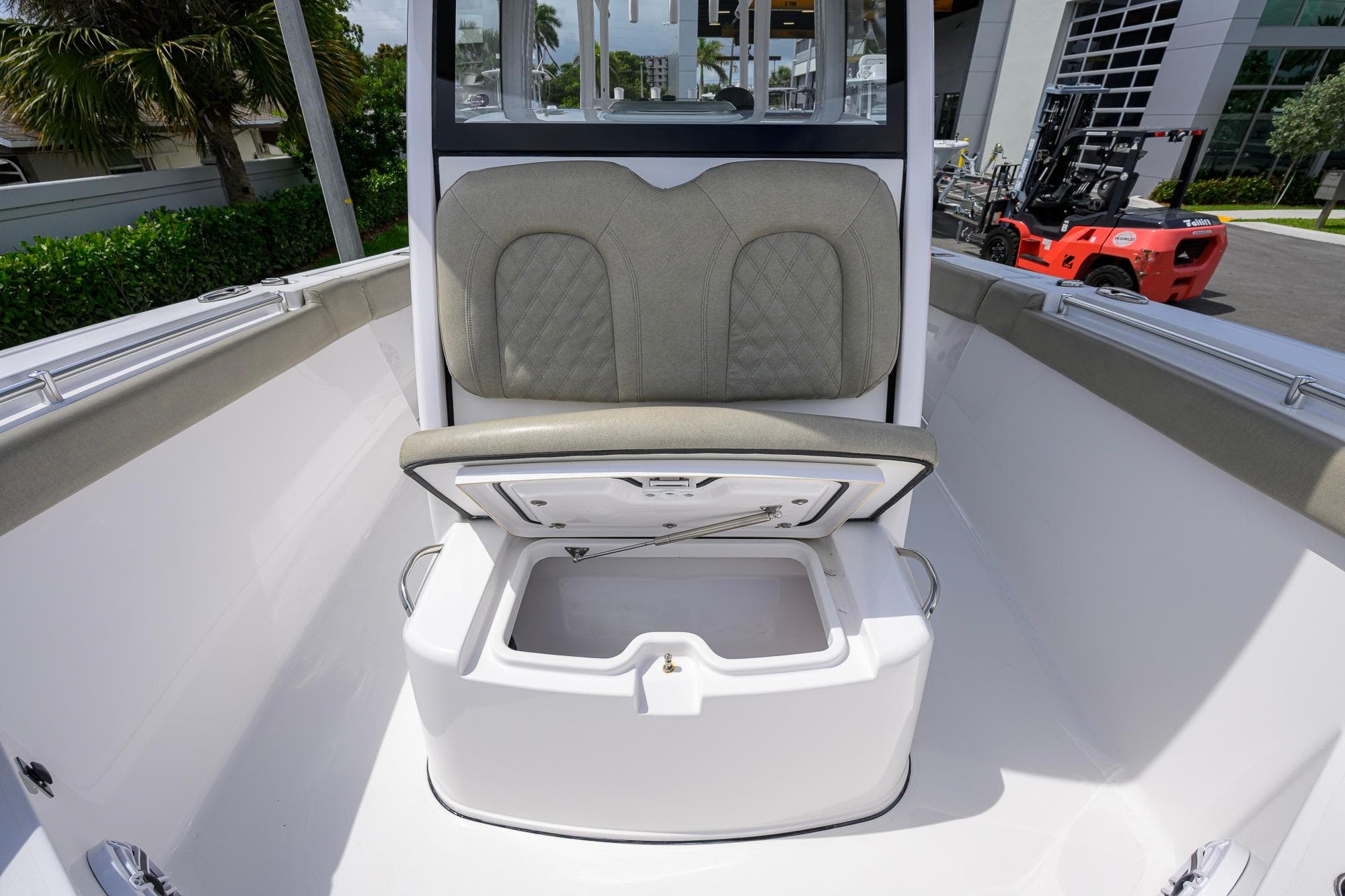 2023 Sportsman Open 302 Center Console boat with open storage compartment.