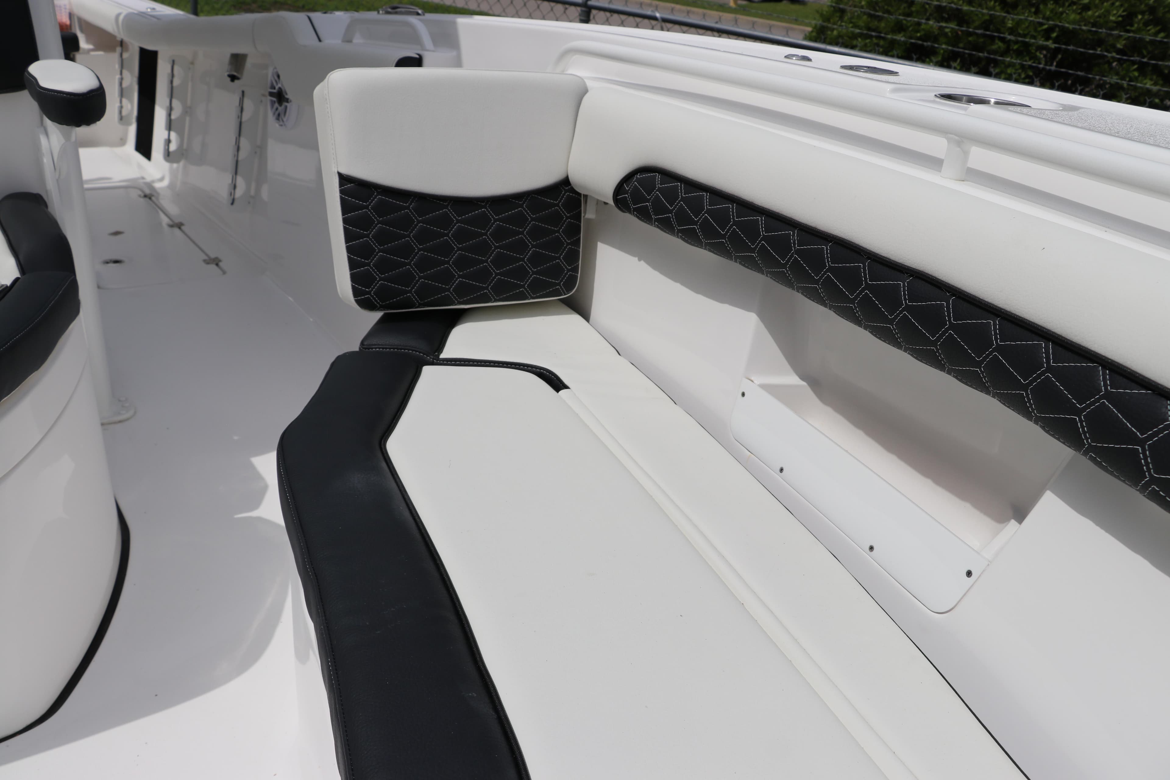 2024 Tidewater 256 LXF boat interior with black and white seating.