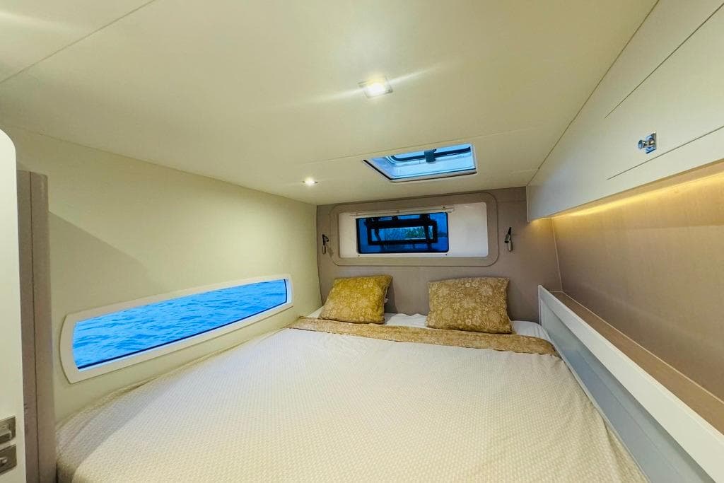 Luxurious cabin interior of 2021 Outremer OUTREMER 59.2 yacht with ocean view windows.