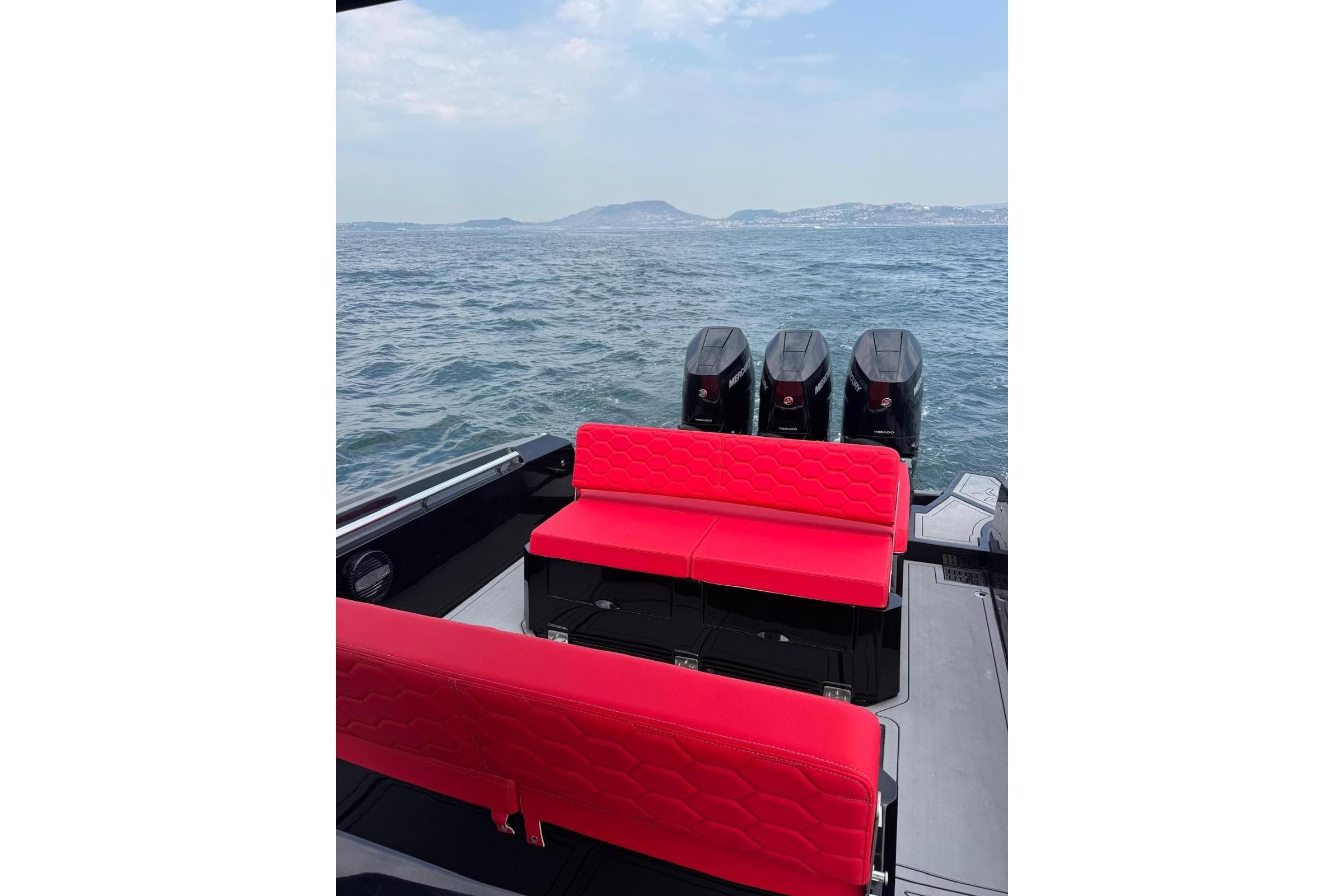 2025 Panamera Yacht PY110 with red seating and quad engines on open water.