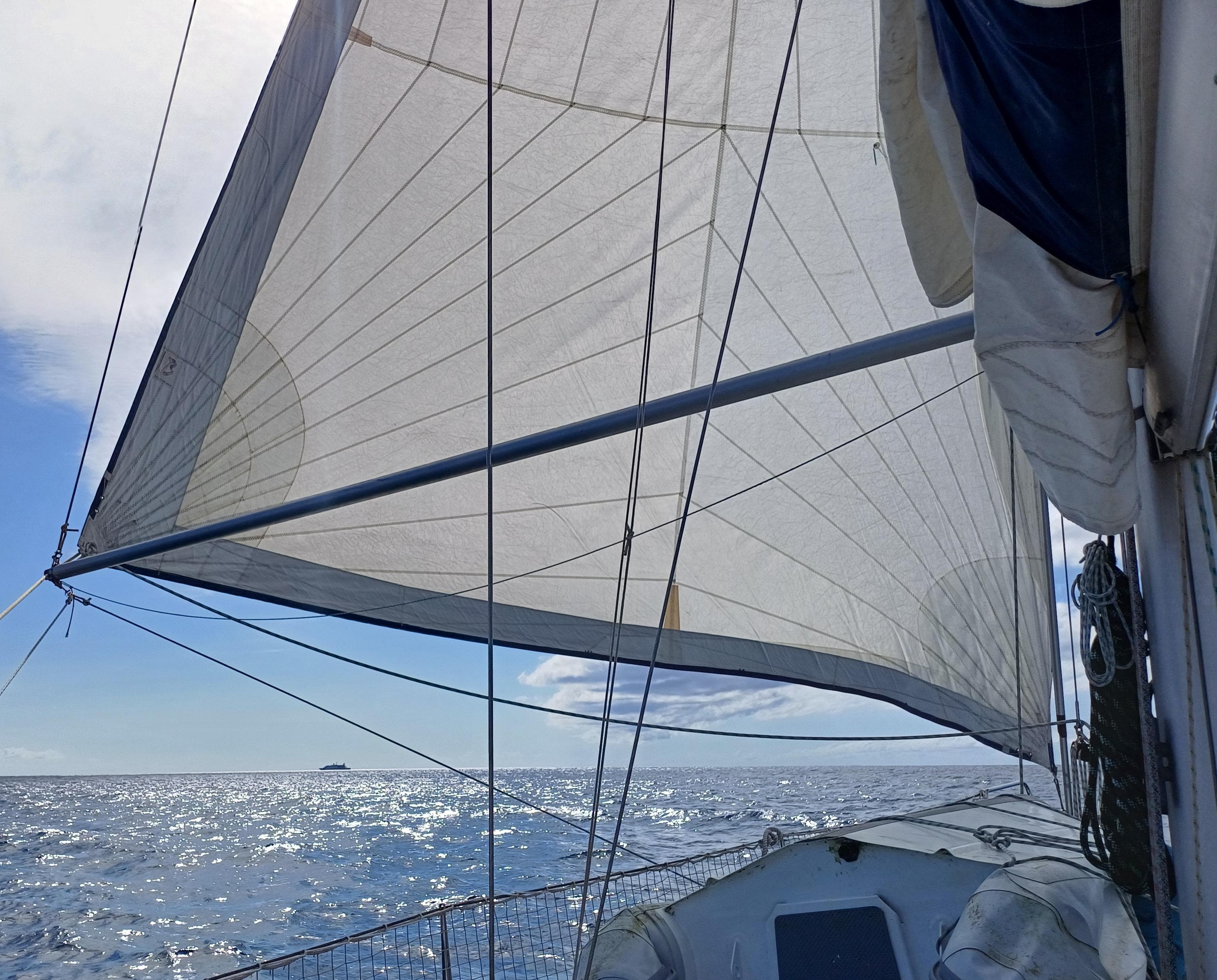 Sailing on a 2001 Beneteau Oceanis 393 with full sails on a sunny day.