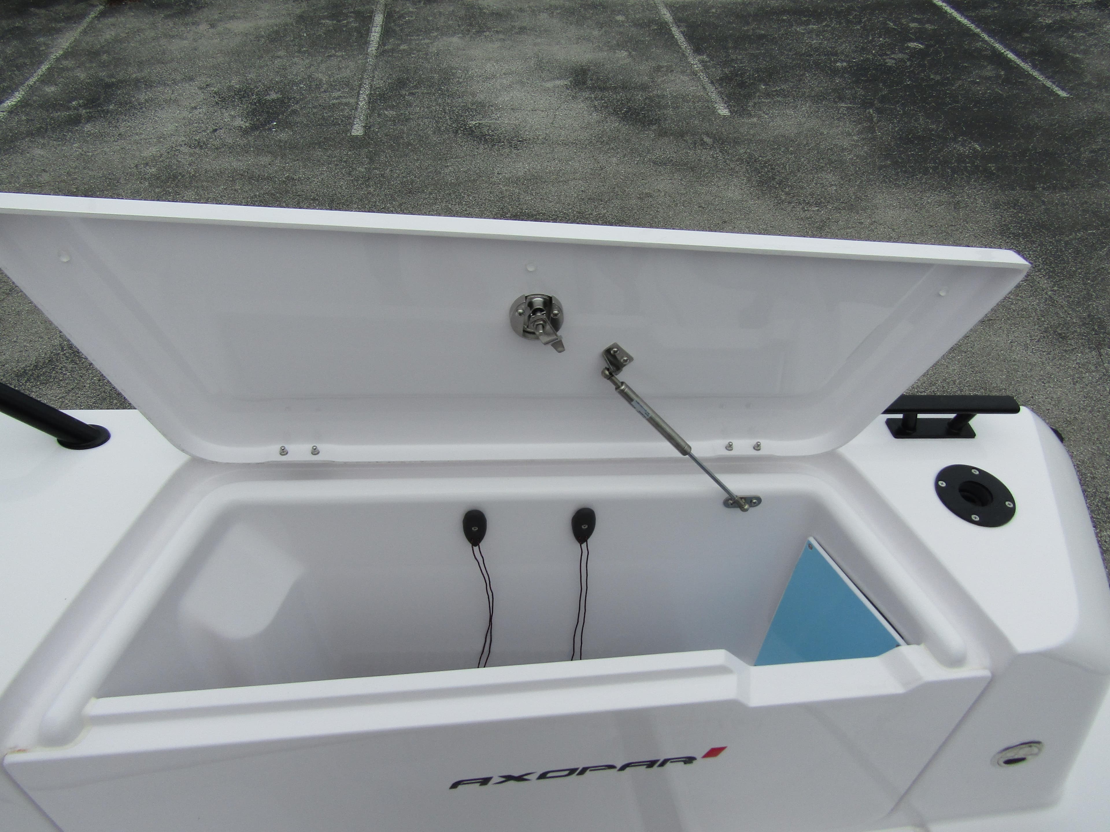Open storage compartment on 2024 Axopar 37XC CROSS CABIN boat.