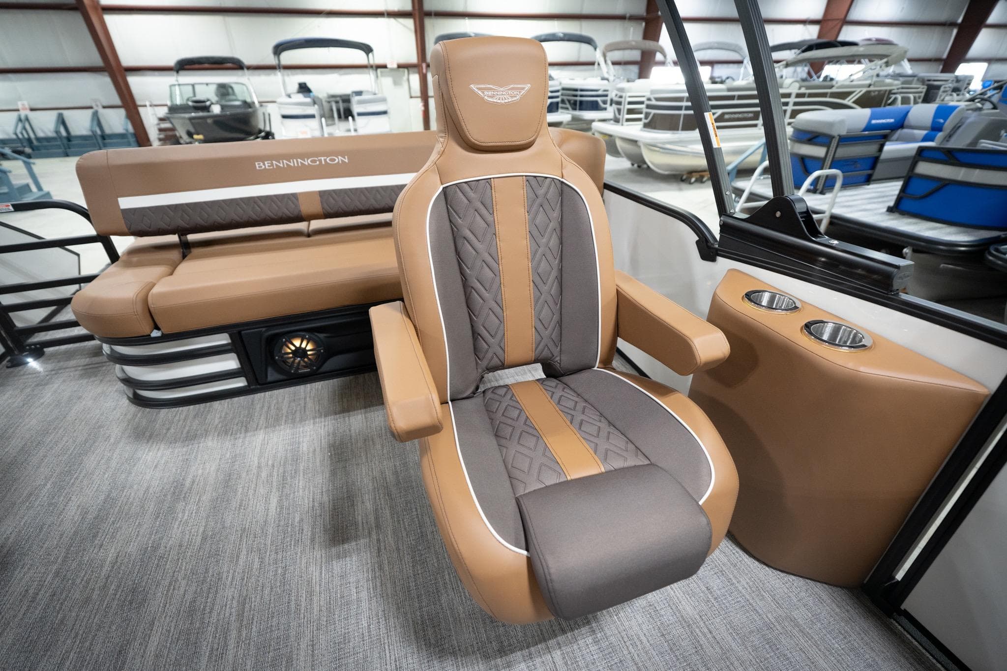2026 Bennington 22 MSB boat interior with luxurious seating and cup holders.