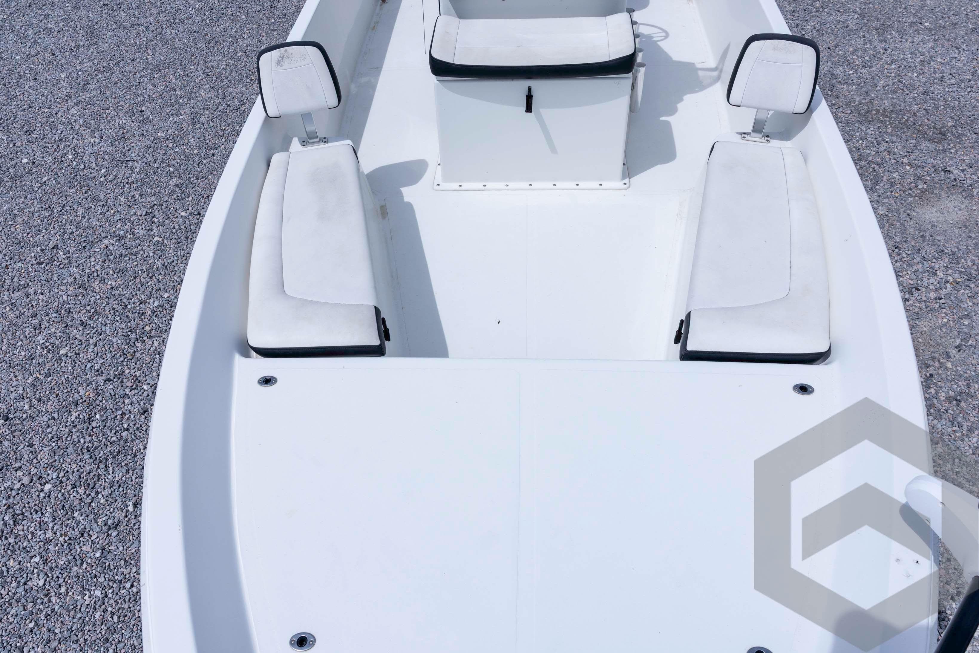 2018 Bay Rider 238 Bay boat interior with white seating and console.