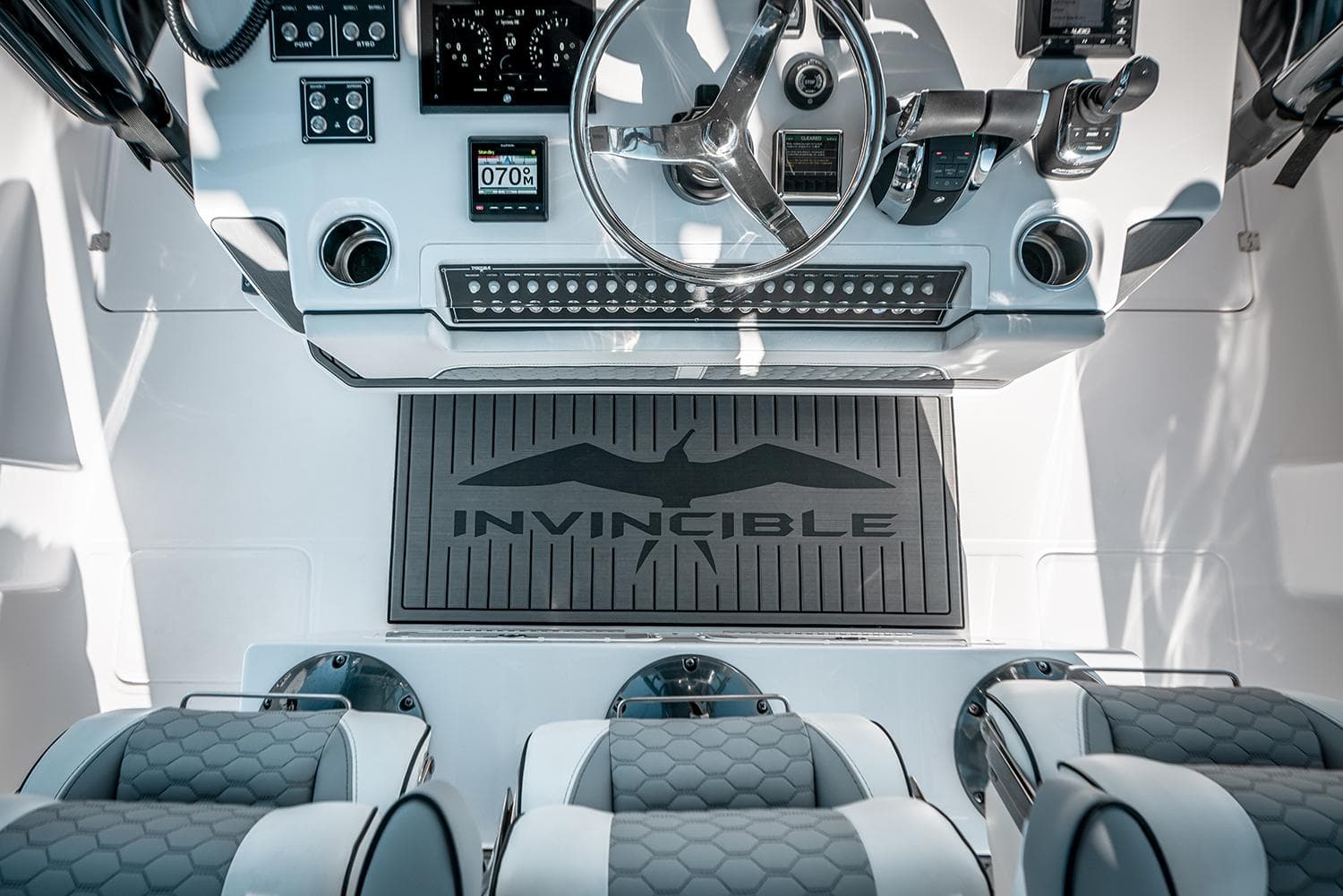 Cockpit of 2026 Invincible 46 Catamaran with modern controls and seating.