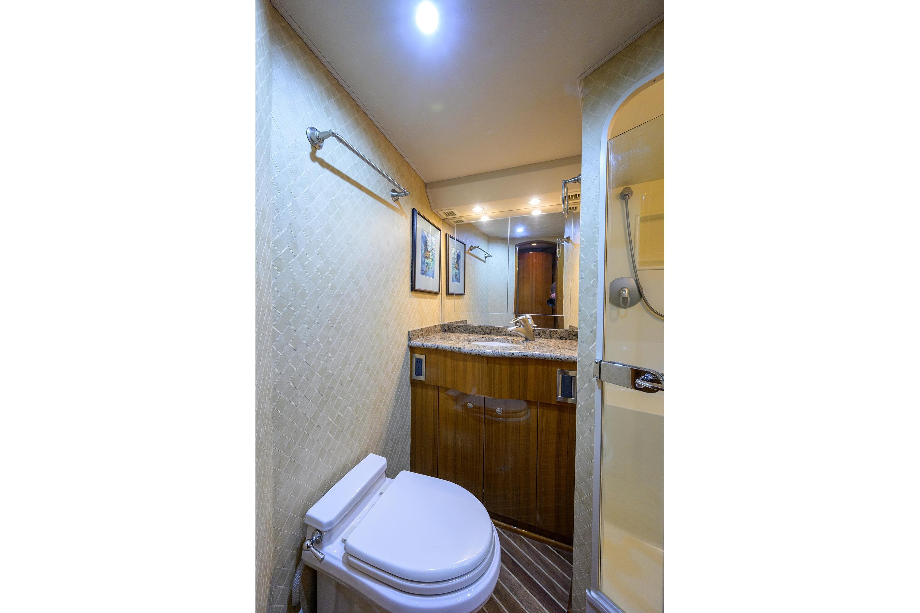 Luxurious bathroom in 2007 Viking 56 Convertible yacht with modern fixtures and elegant design.