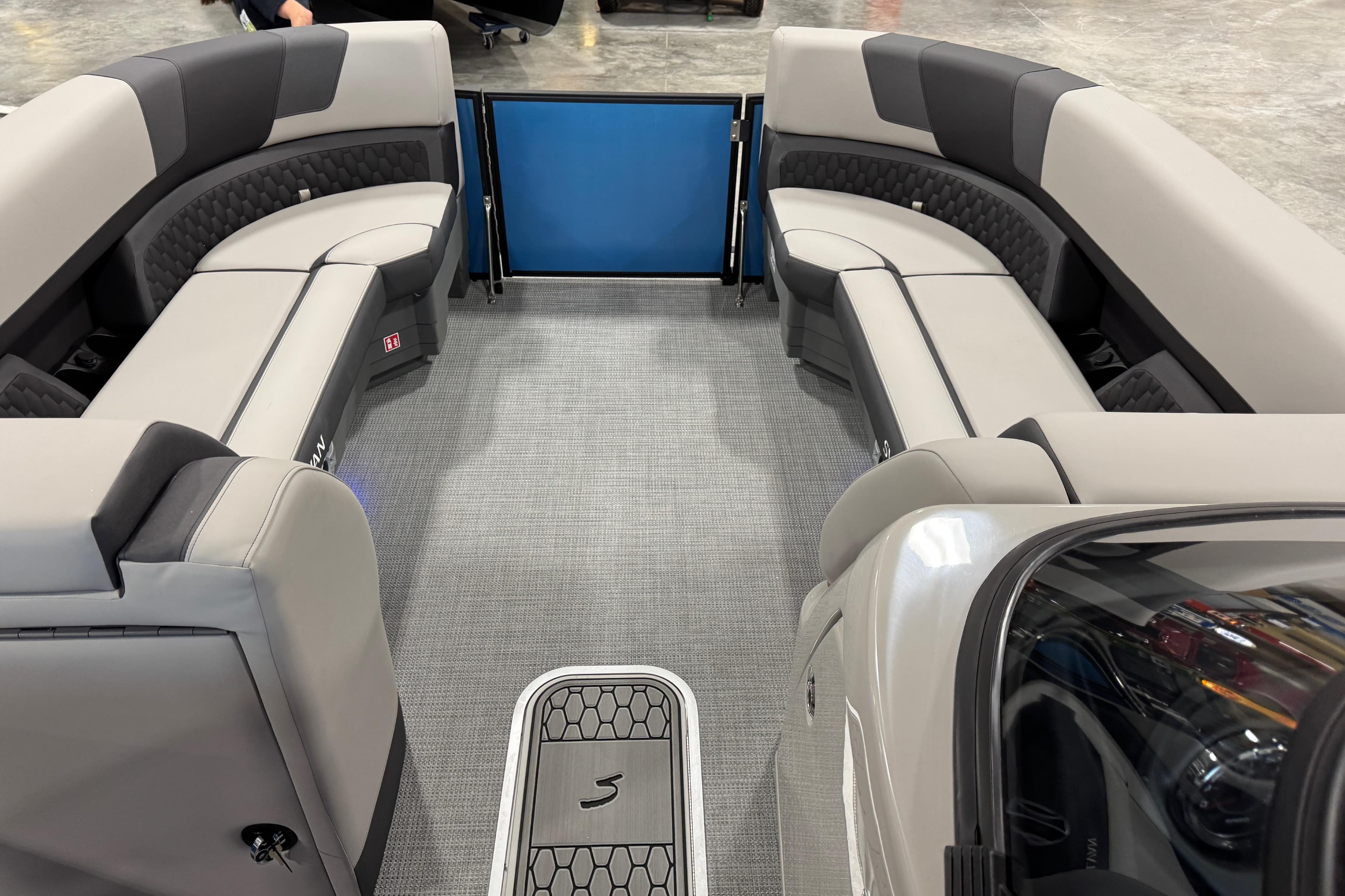 Interior of 2026 Sylvan L5 boat with spacious seating and modern design.