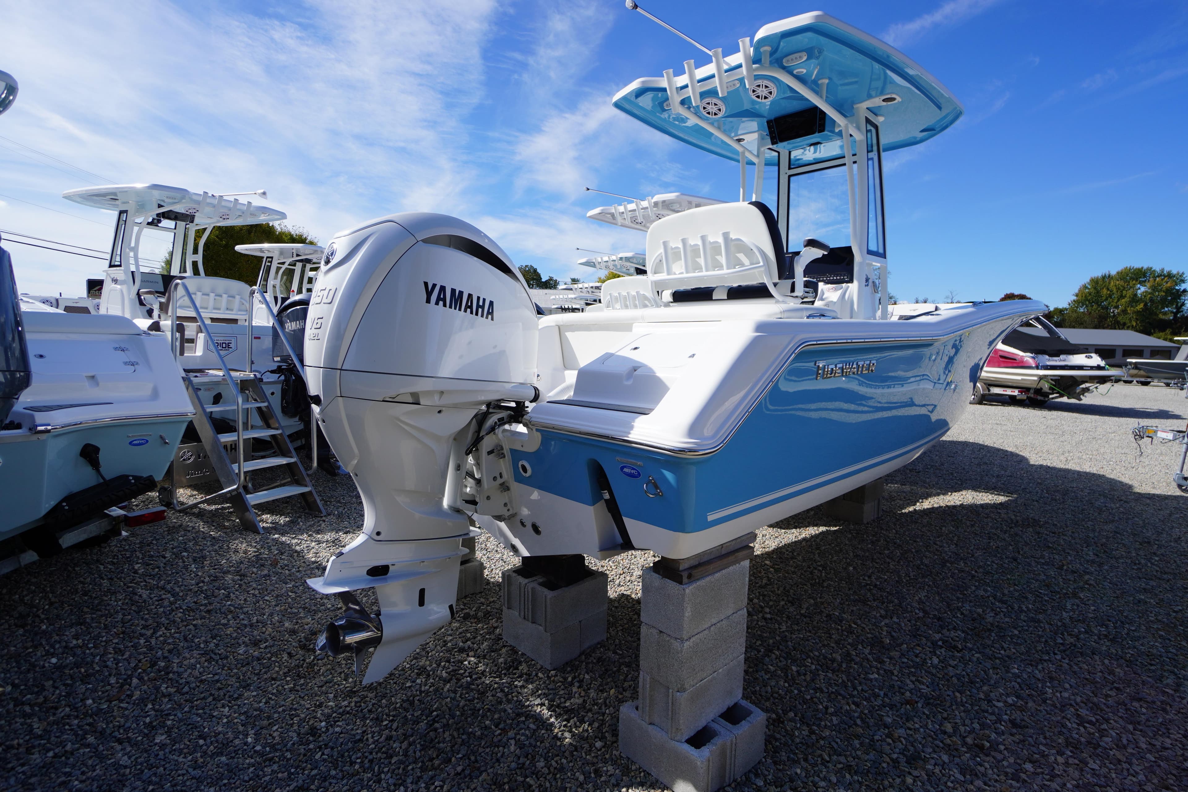 2026 Tidewater 220 LXF boat with Yamaha engine on display outdoors.