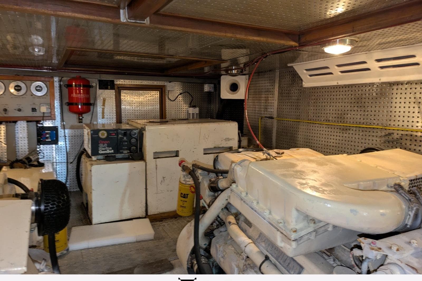 Engine room of a 1994 Trader 58 Sunliner yacht with machinery and equipment.