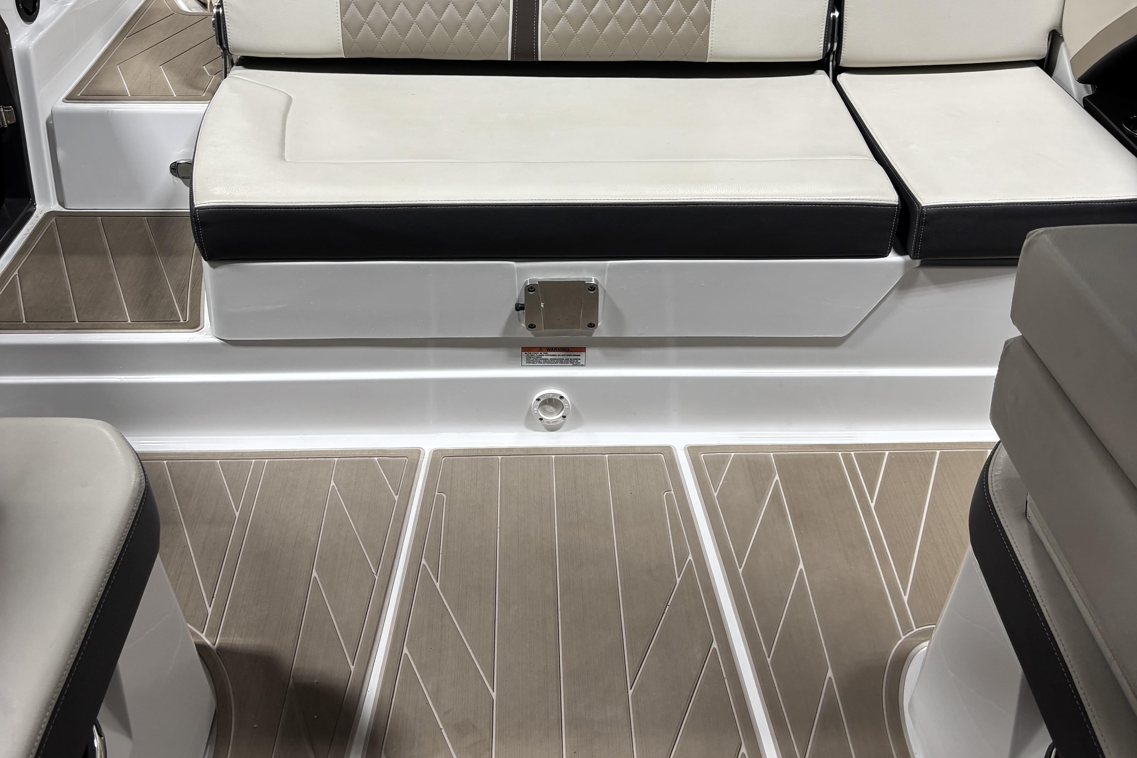 2023 Monterey 278SS Super Sport boat interior with cushioned seating and stylish flooring.