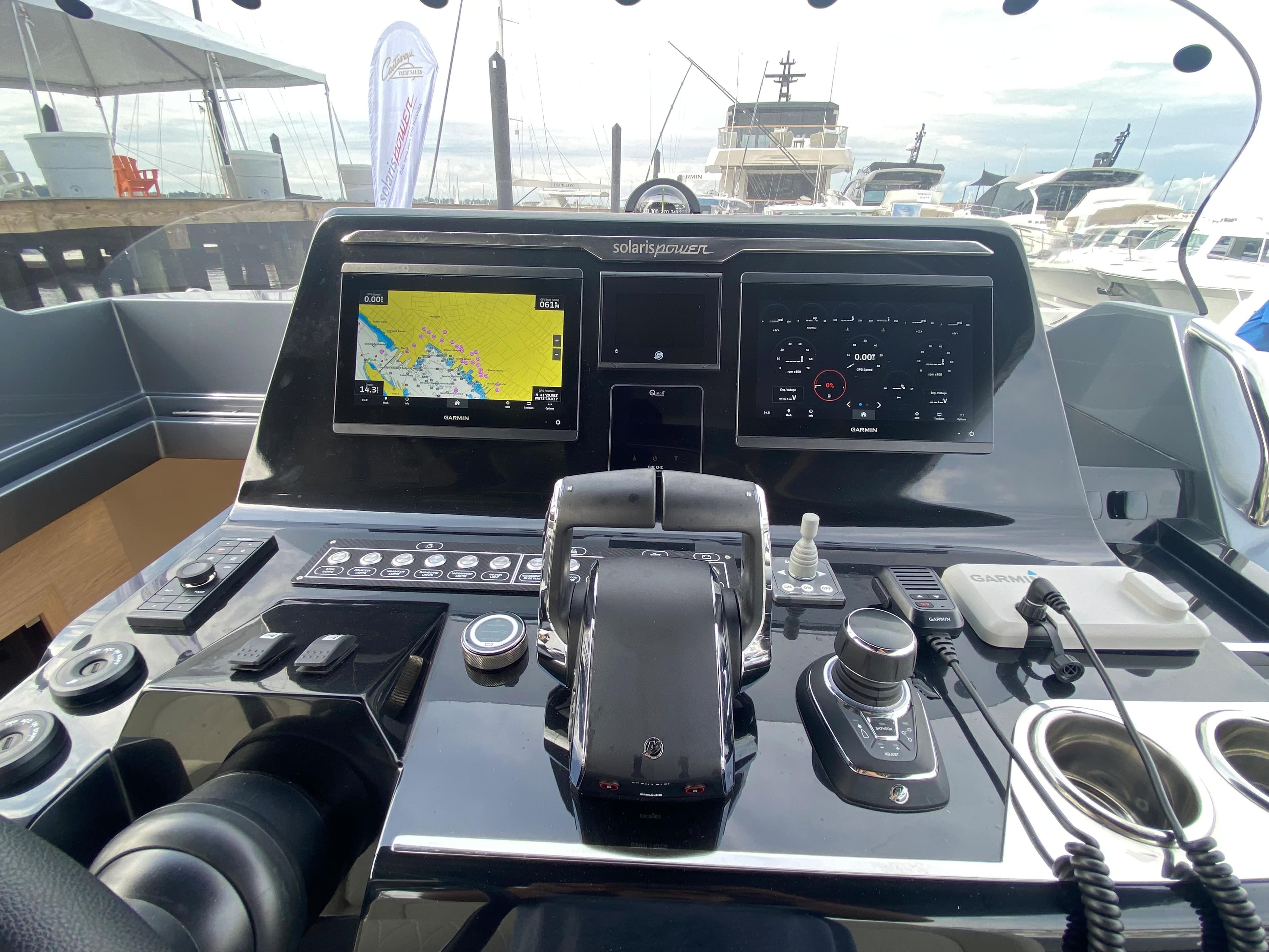 2024 Solaris Power 40F open yacht dashboard with navigation screens and controls.