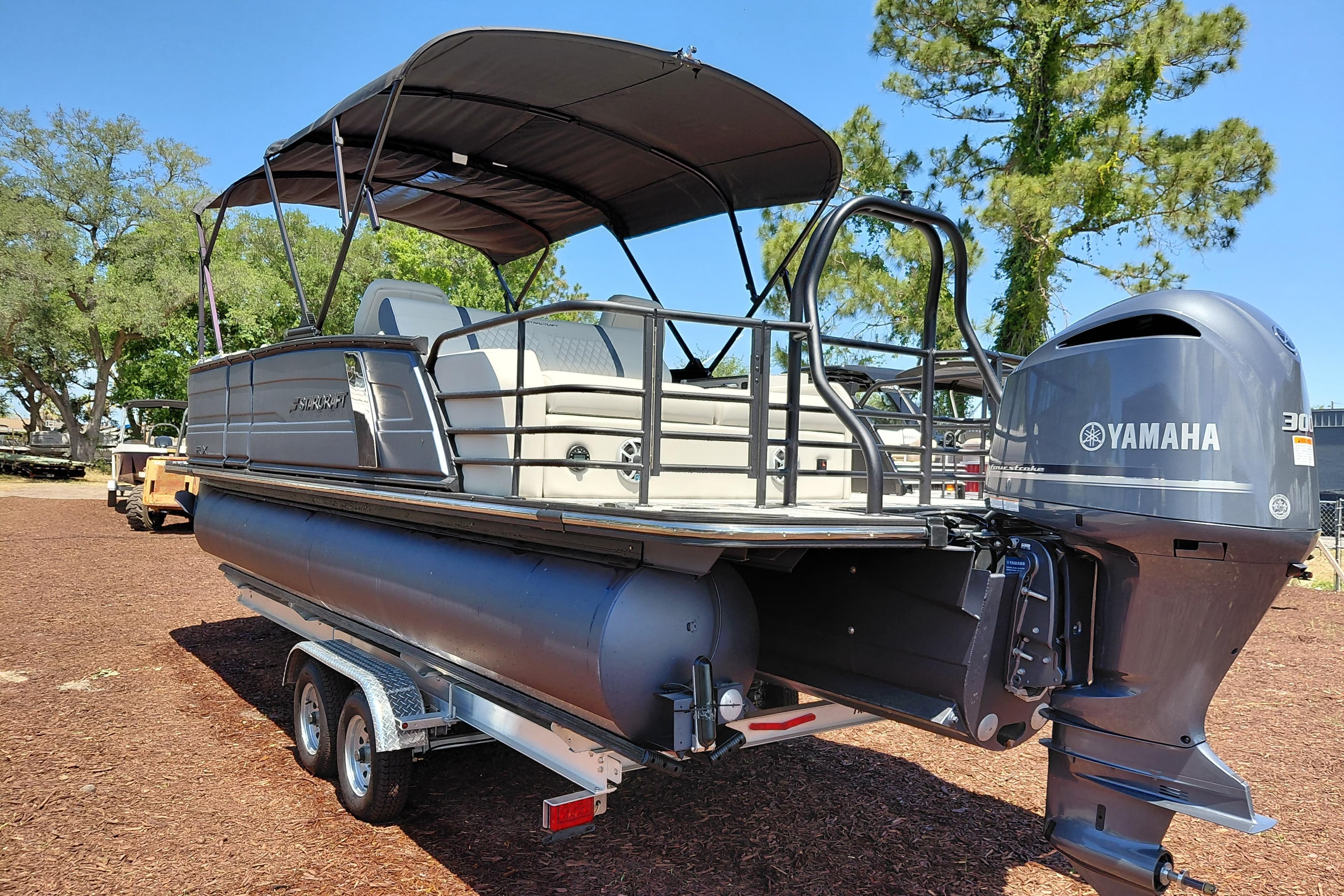 2026 Starcraft RX 23 Q DH pontoon boat with Yamaha engine on trailer.