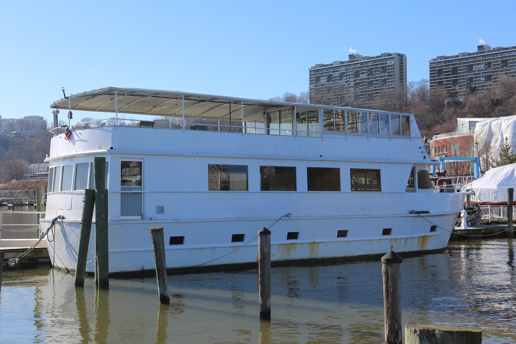 Custom 1988 Winston Knauss 64 dinner or party boat docked at marina.