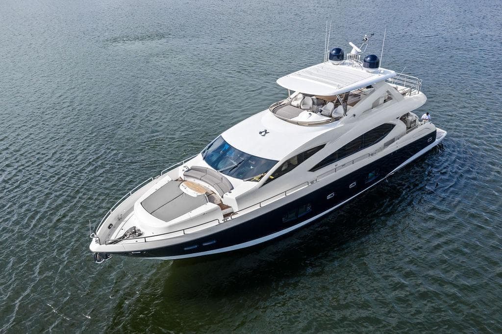 Luxurious 2012 Sunseeker 88 Yacht cruising on calm waters.