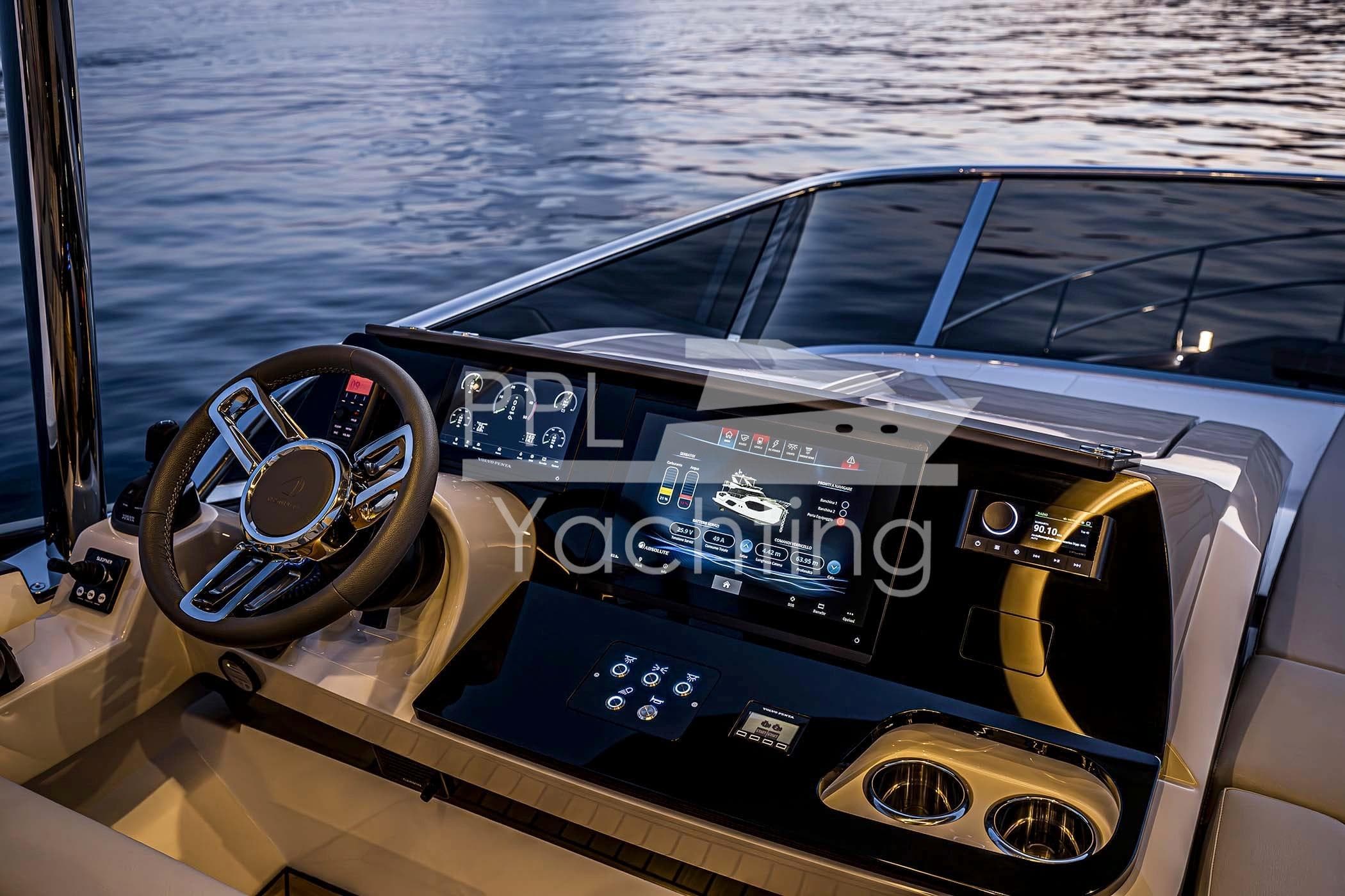 Helm of 2026 Absolute 52 FLY yacht with advanced navigation controls and touchscreen display.