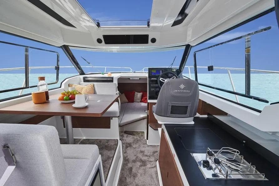 Interior of 2026 Jeanneau NC 795 Series 2 boat with modern amenities and ocean view.