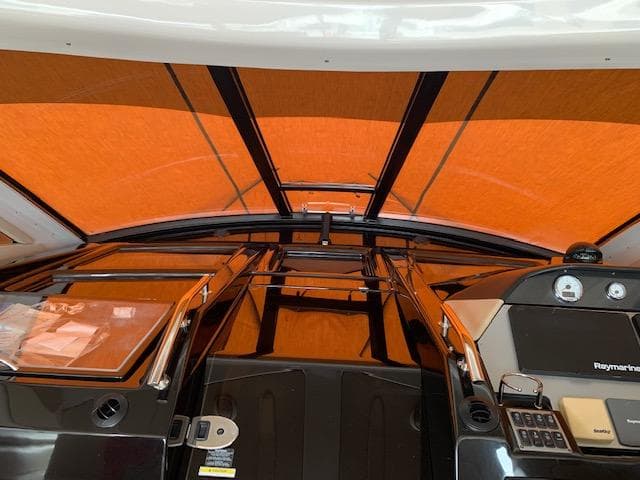 Interior view of 2015 Regal 42 Sport Coupe with orange canopy.