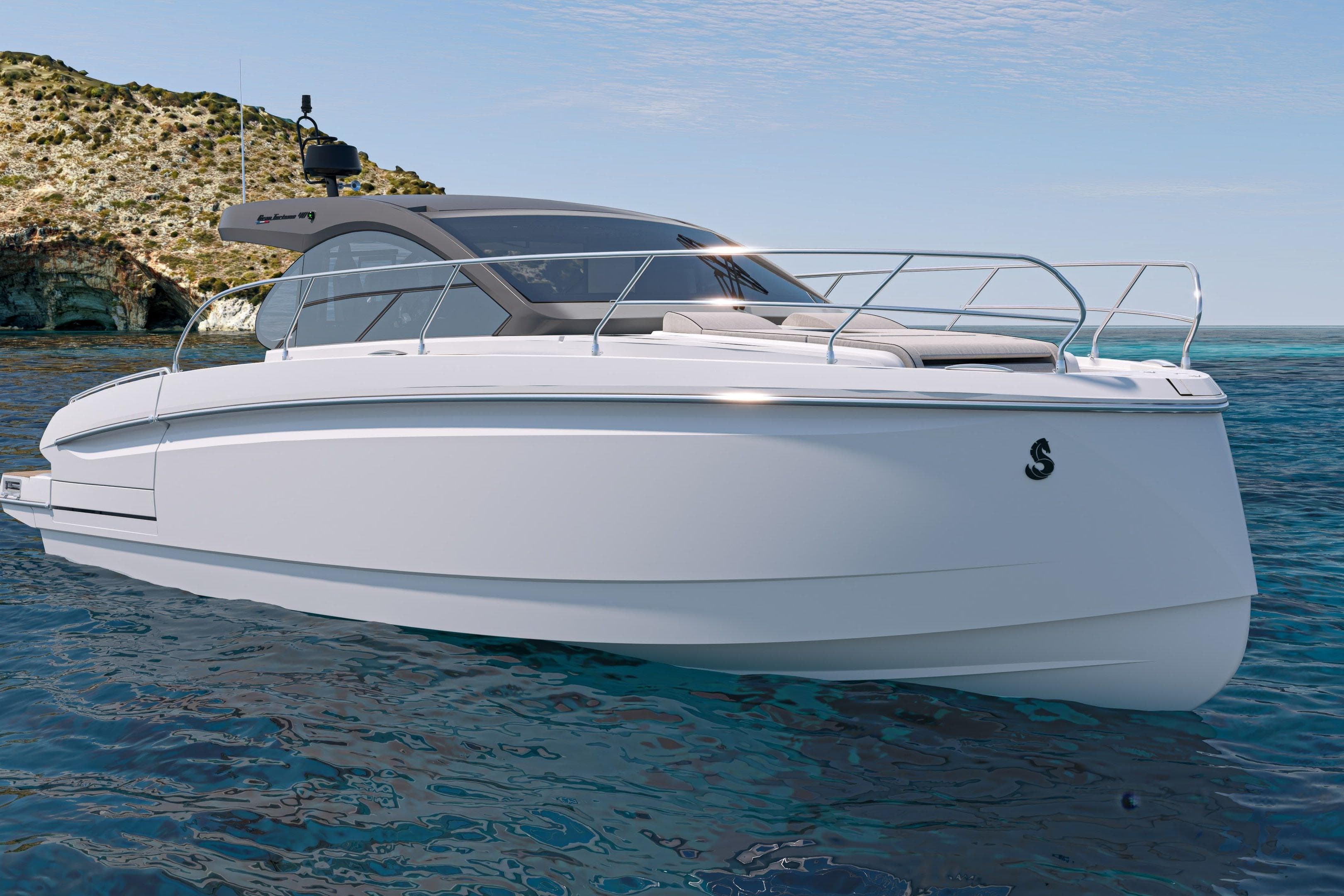 2026 Beneteau Gran Turismo 40 yacht on clear blue water near rocky coastline.
