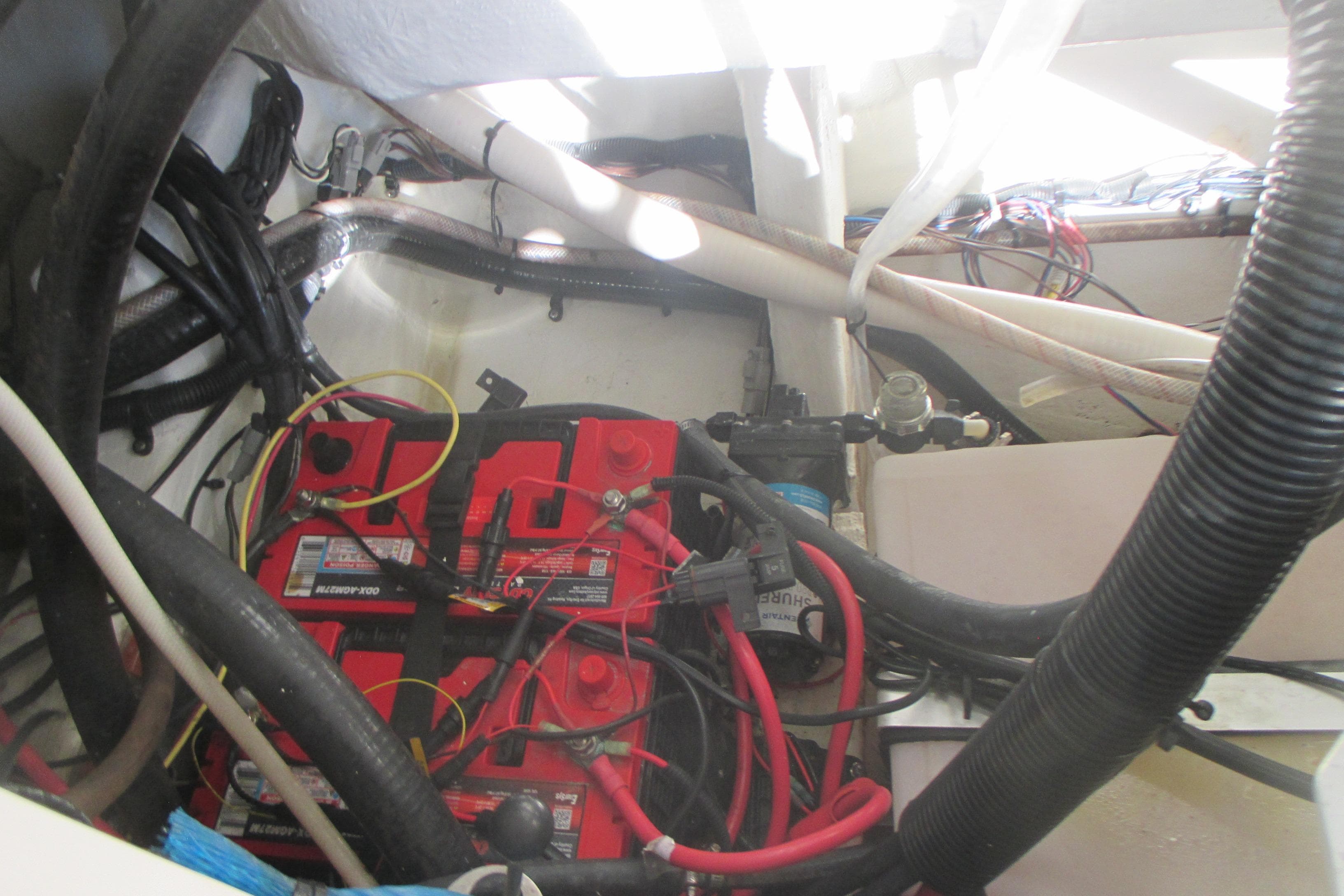 2019 Sailfish 325 DC boat battery compartment with wiring and connections.