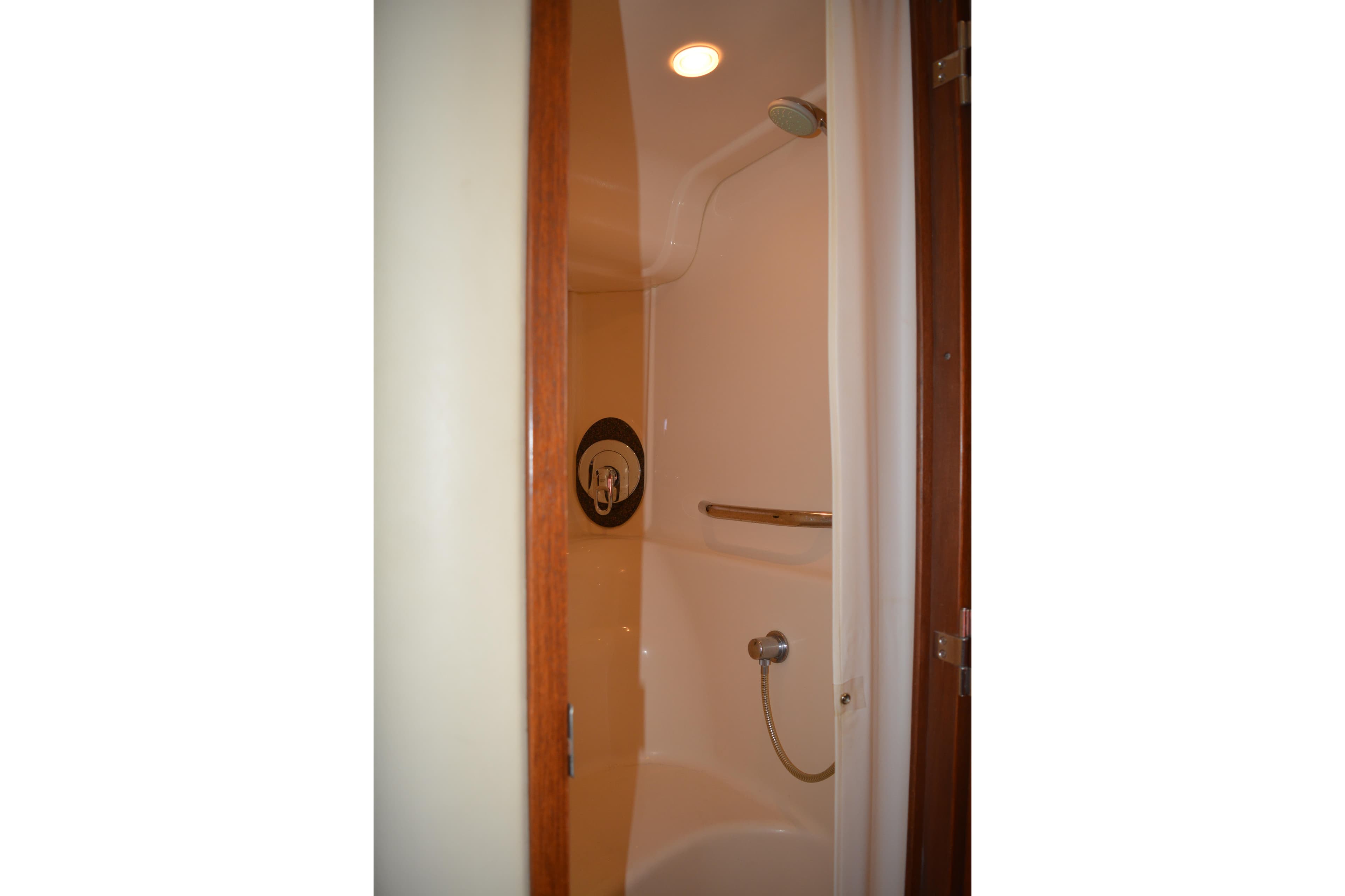 Shower area inside 2007 Sea Ray 44 Sundancer yacht, featuring sleek design and modern fixtures.