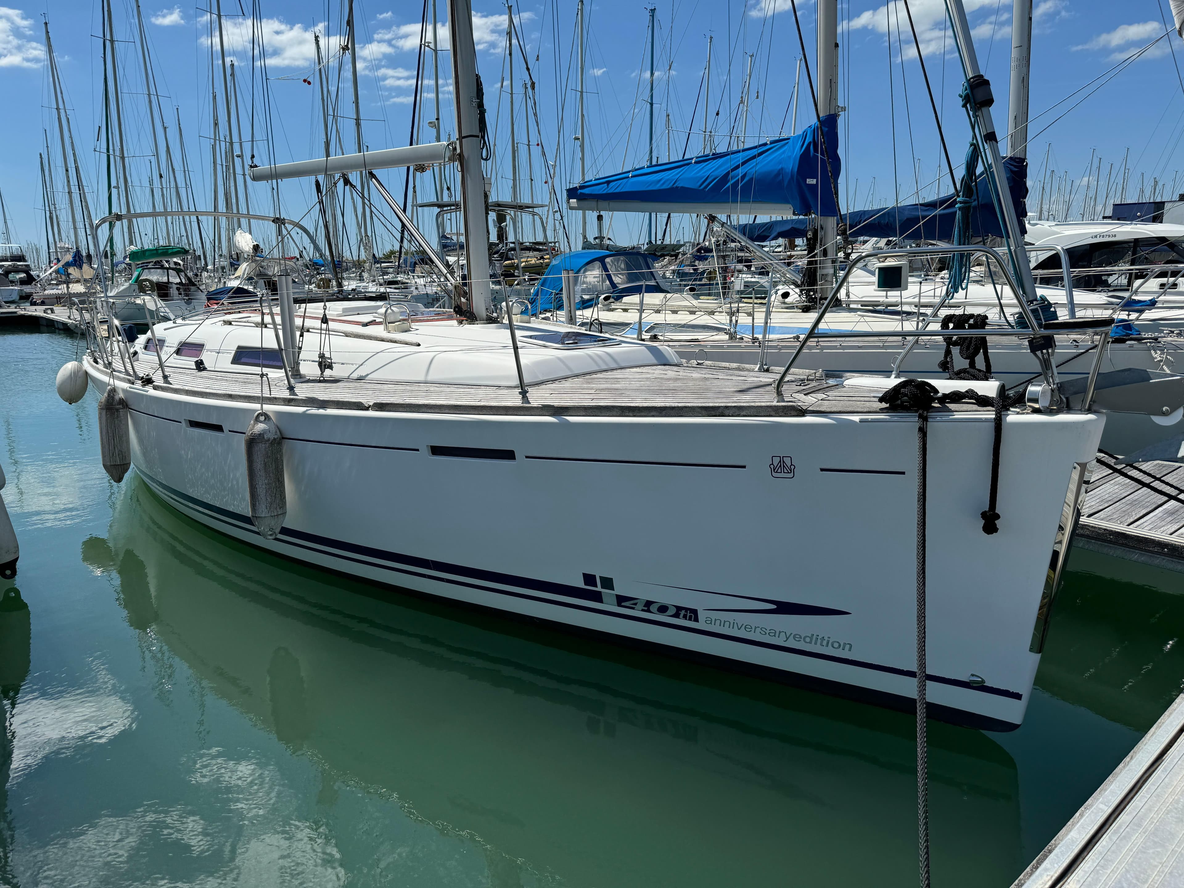 2008 Dufour 365 sailboat docked in marina, sunny day.