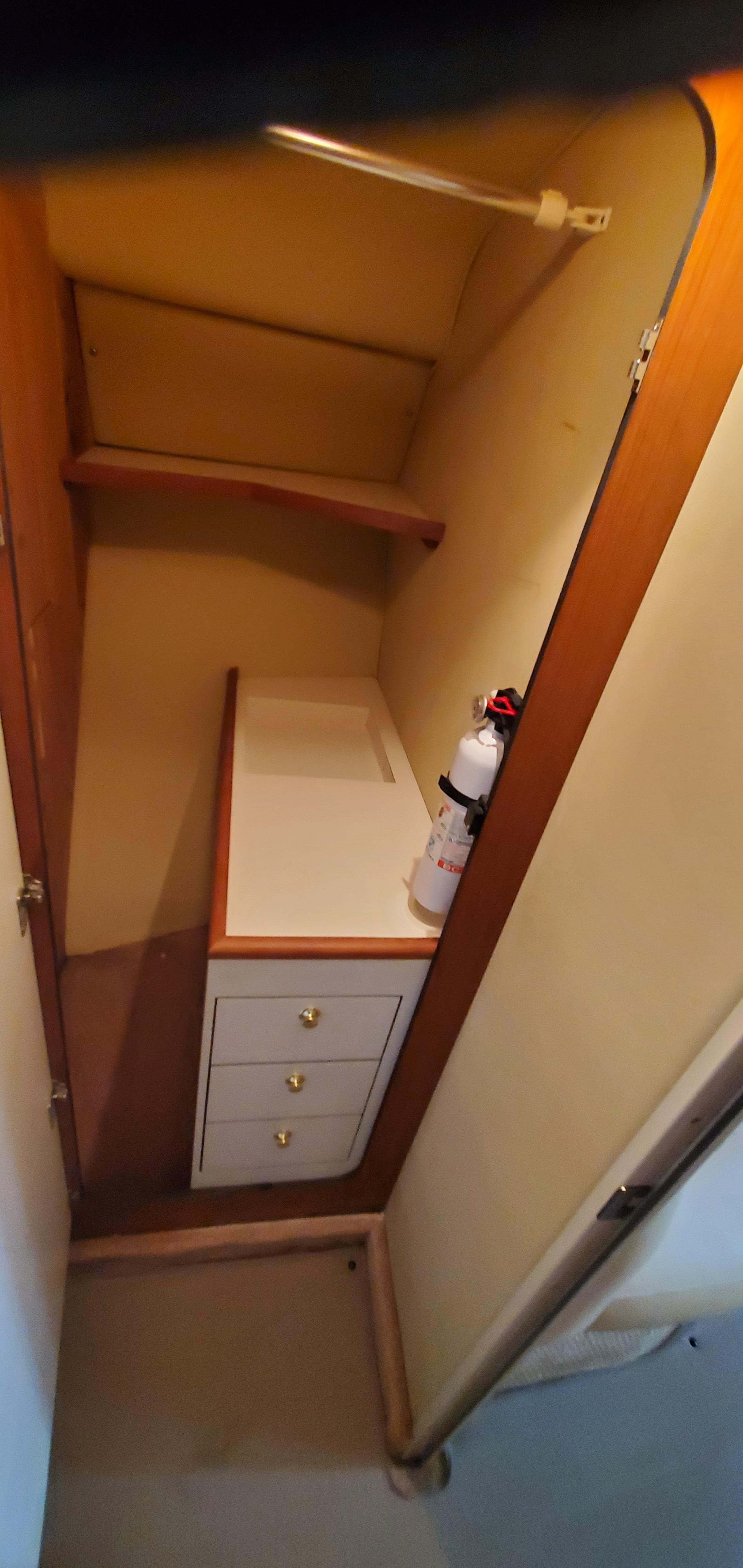 1998 Sea Ray 400 Sundancer interior closet with shelves and drawers