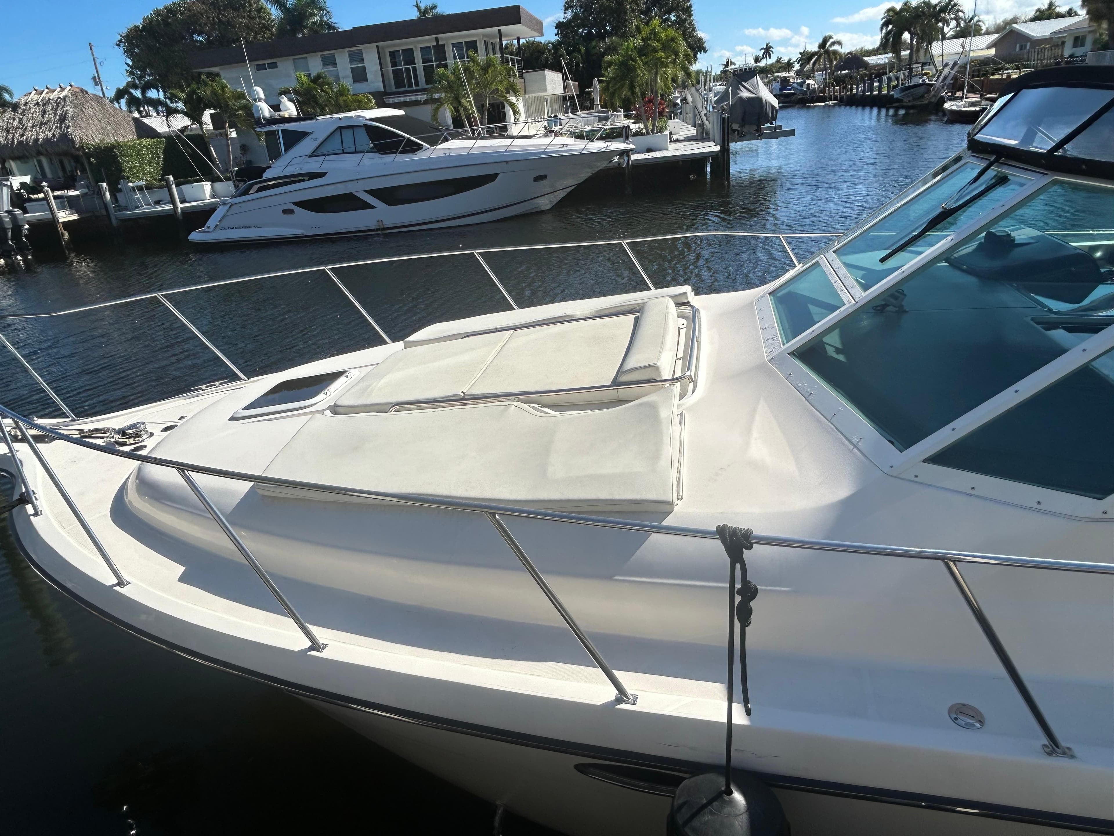 1998 Tiara Yachts 3500 Express docked in a sunny marina setting.