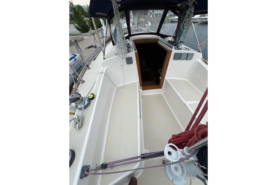 1992 Tartan 31 Piper sailboat cockpit with ropes and winches, docked at marina.