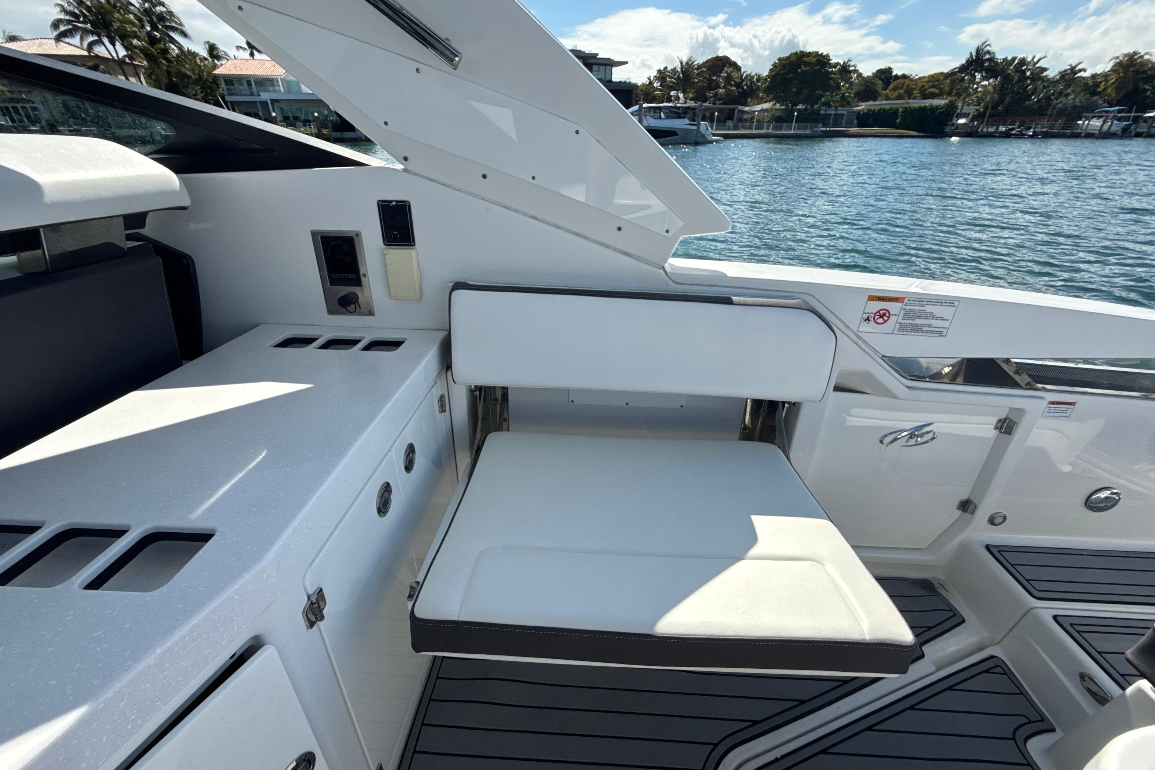 2019 Monterey 385 Super Express boat interior with white seating and sleek design.