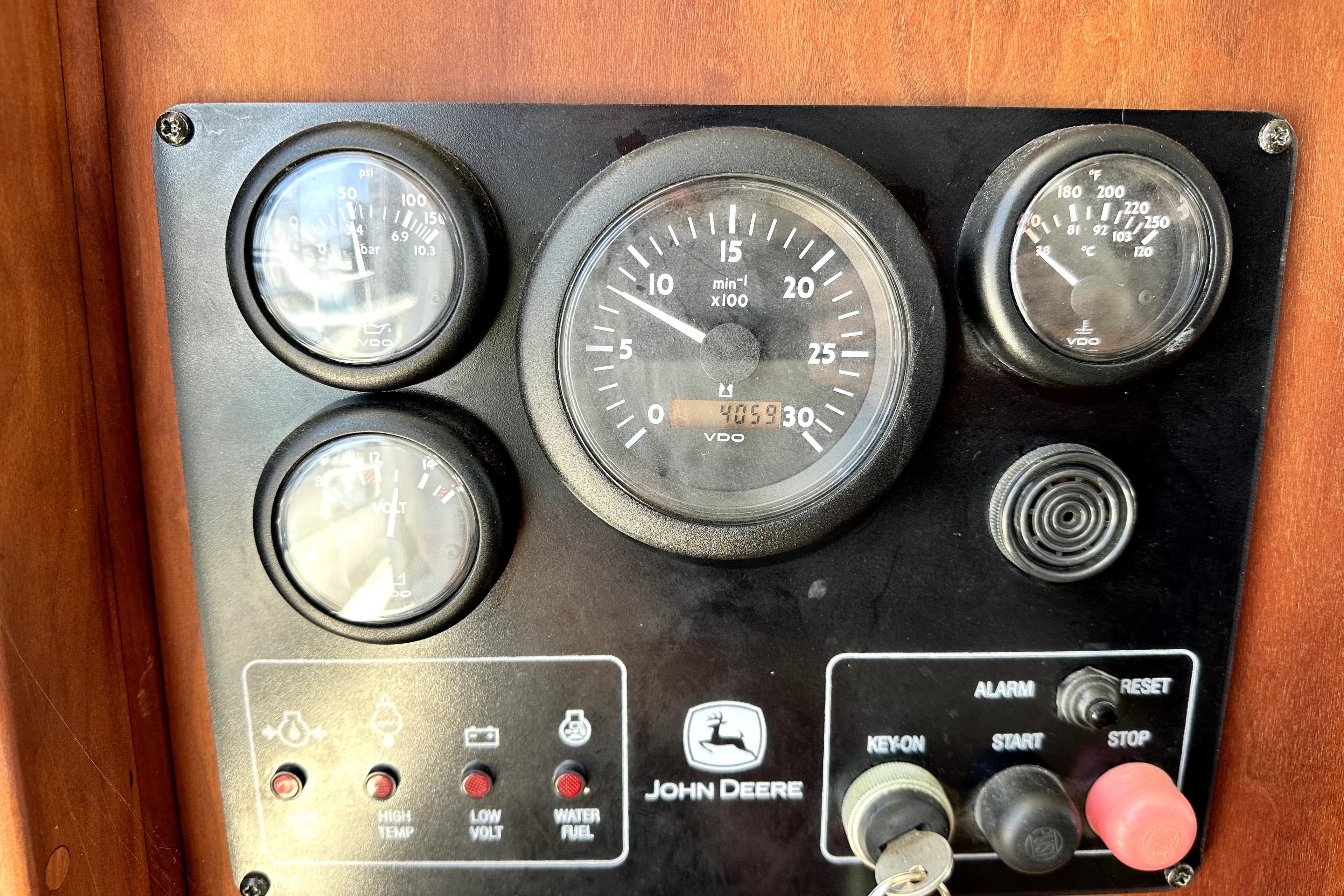 Control panel of a 2012 Custom Pacific Northwest 43 boat with gauges and switches.