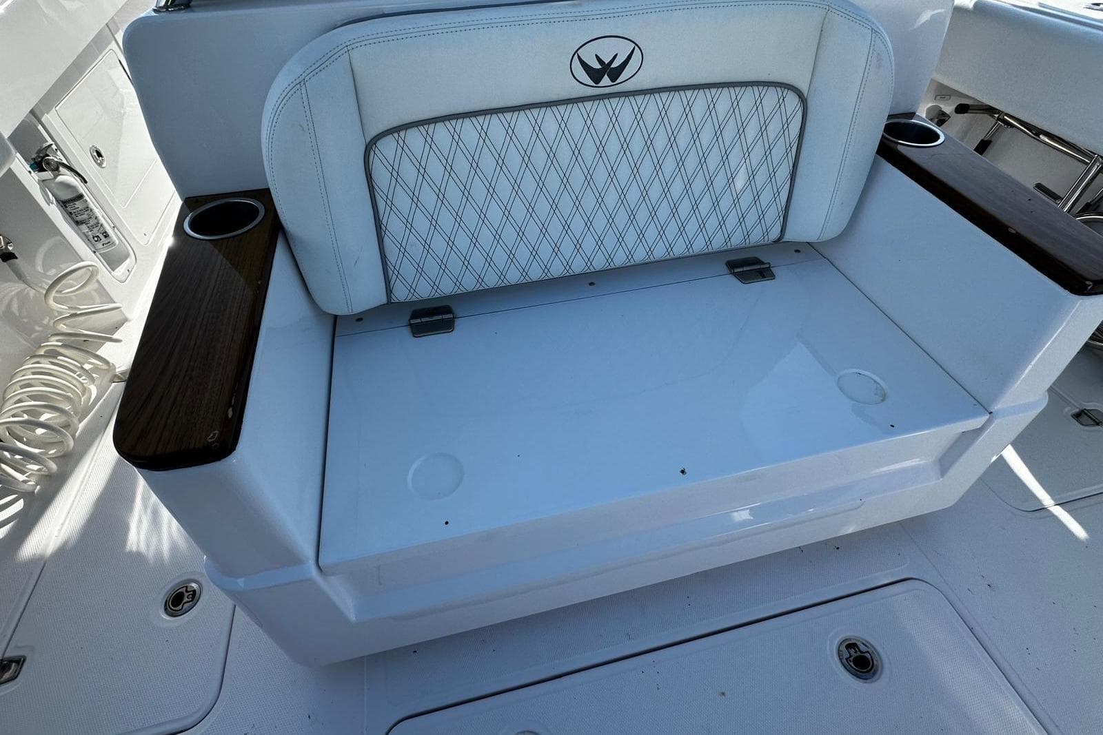 2024 Southport 30 FE boat seating with cup holders and diamond-patterned upholstery.