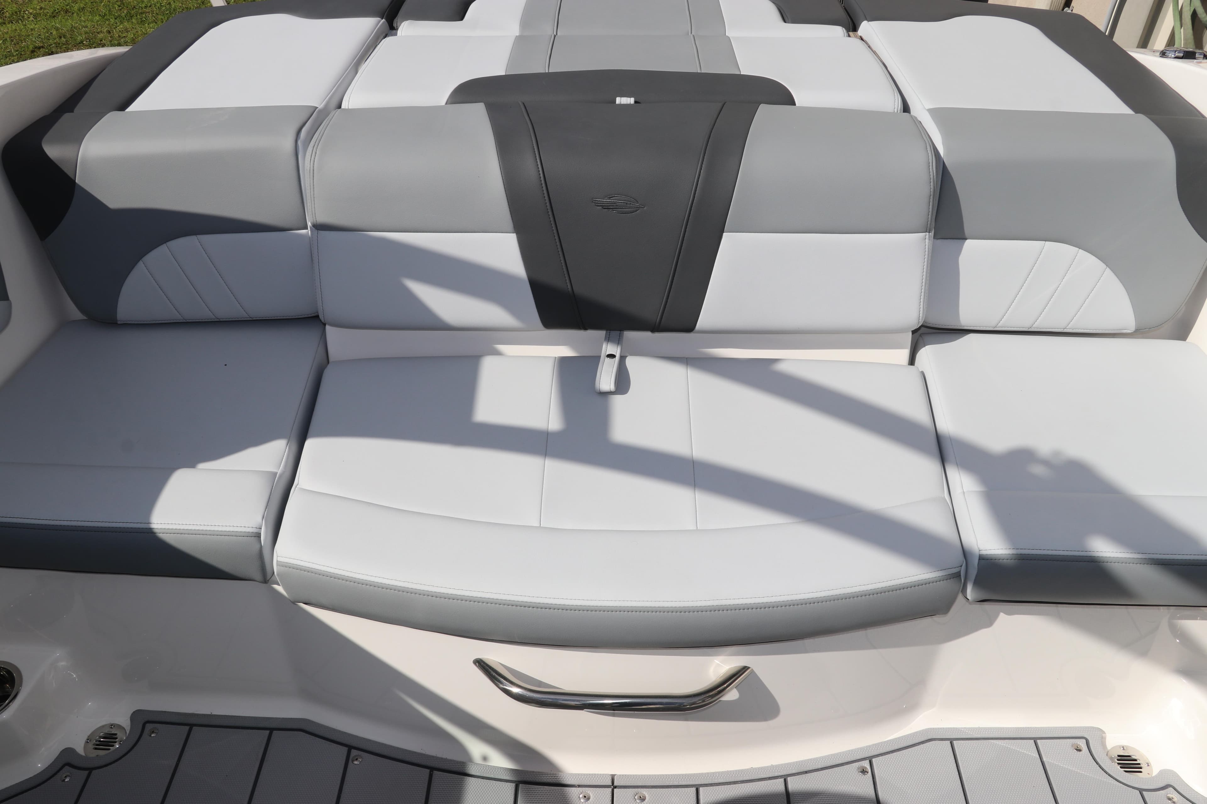 2026 Chaparral 21 SSi OB boat seating, featuring sleek gray and white upholstery design.