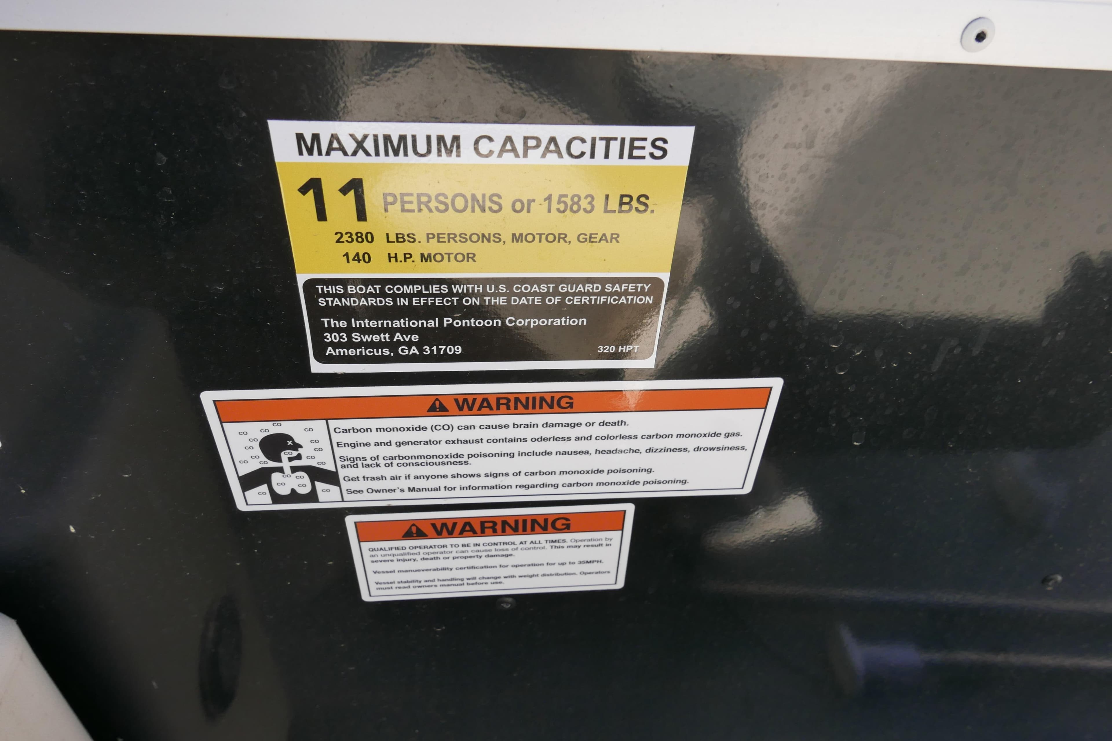 2022 Lexington 320HPT capacity label: 11 persons, 1583 lbs, 140 HP motor warning.