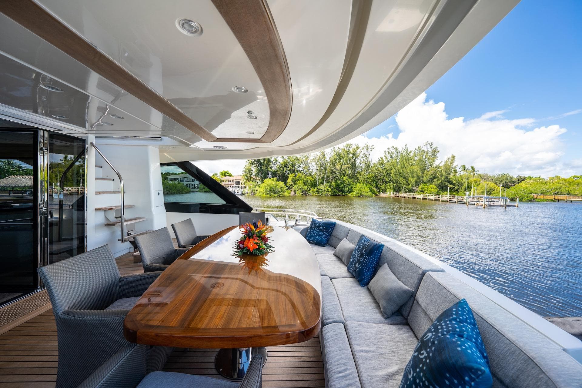 Luxurious 2015 Monte Carlo Yachts MCY 86 deck with elegant seating and scenic water view.
