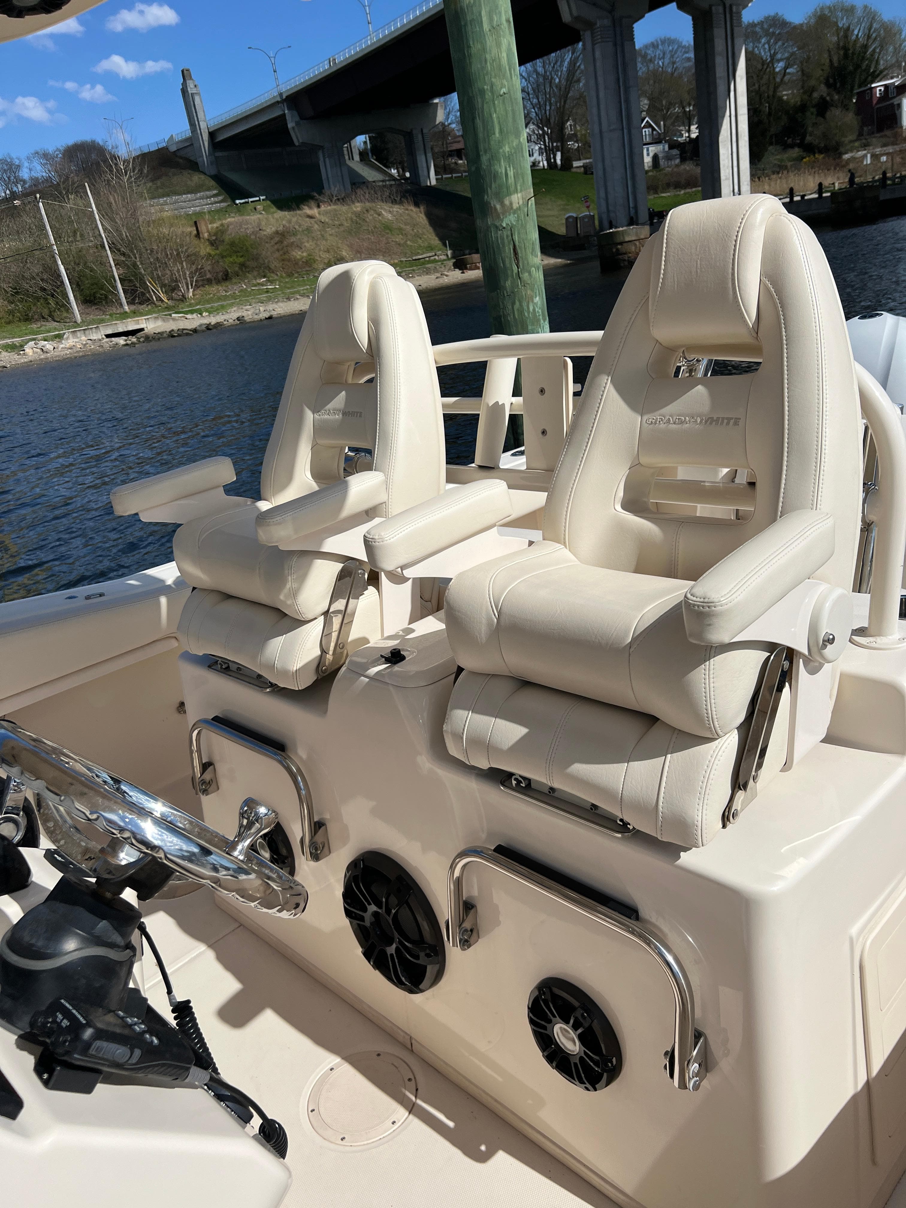 2019 Grady-White Canyon 306 boat interior with luxurious seating and steering wheel.
