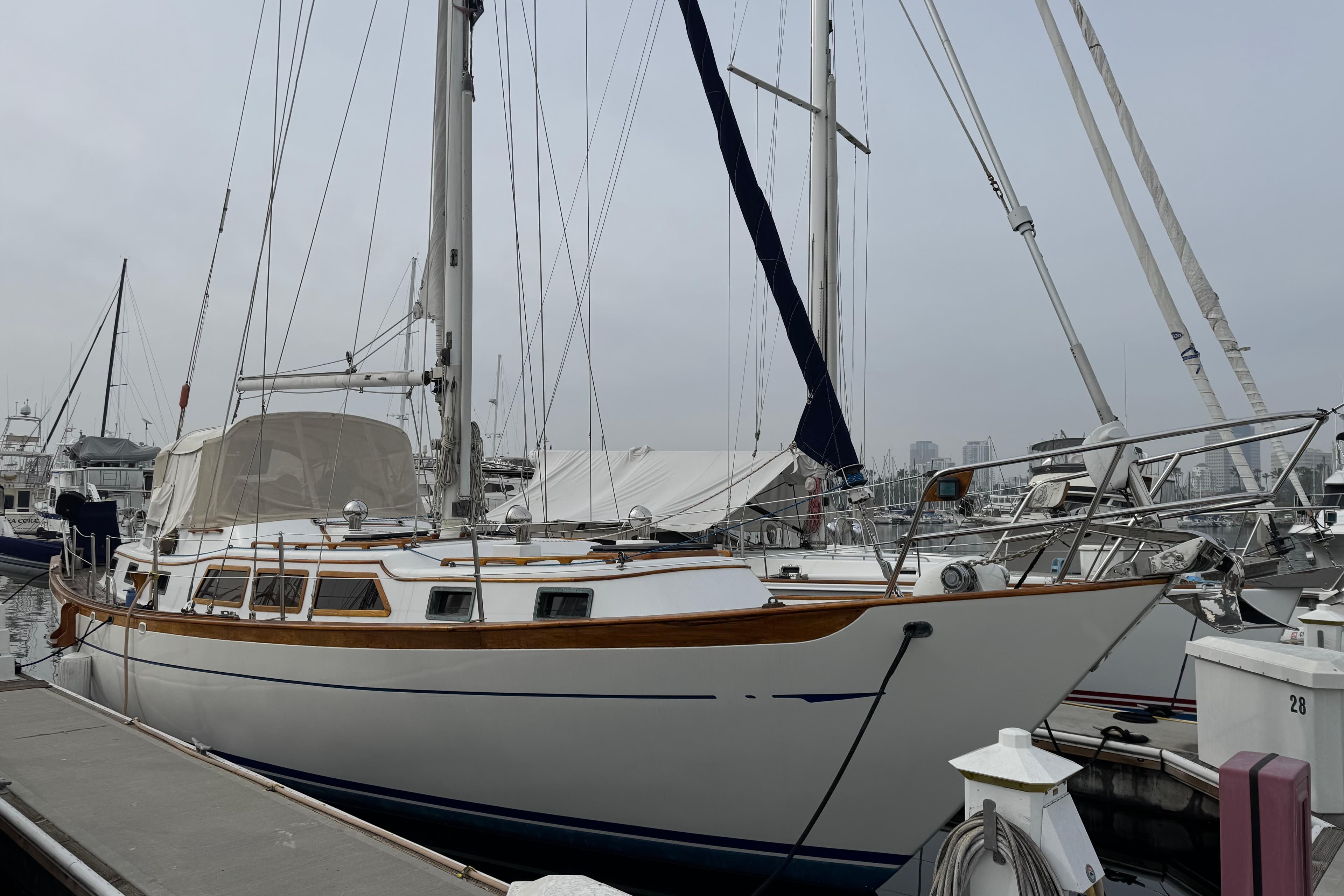 Classic 1978 Robert Perry 47 sailboat docked at marina, showcasing elegant design and craftsmanship.