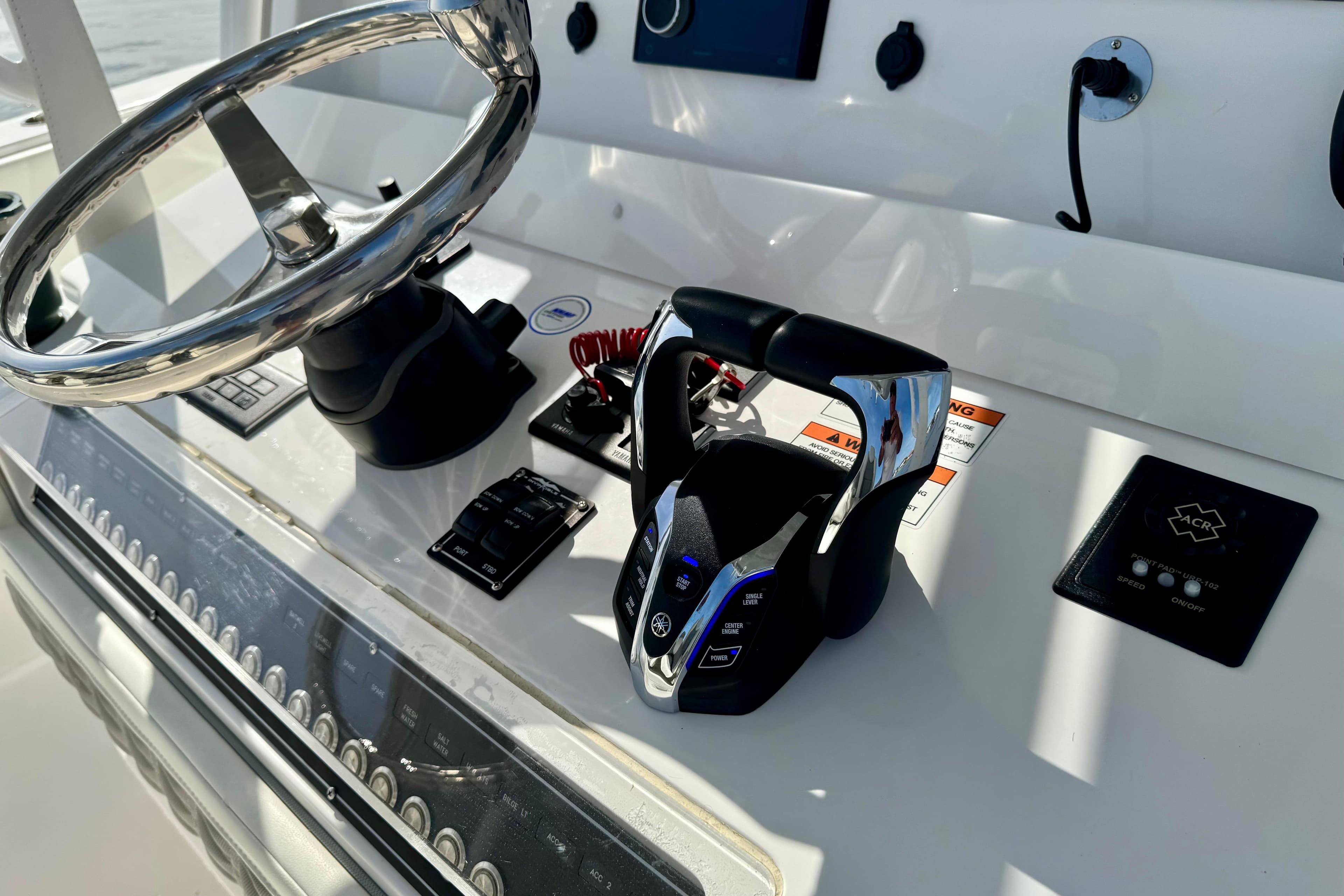 2024 Invincible 39 Open Fisherman helm with steering wheel and controls.