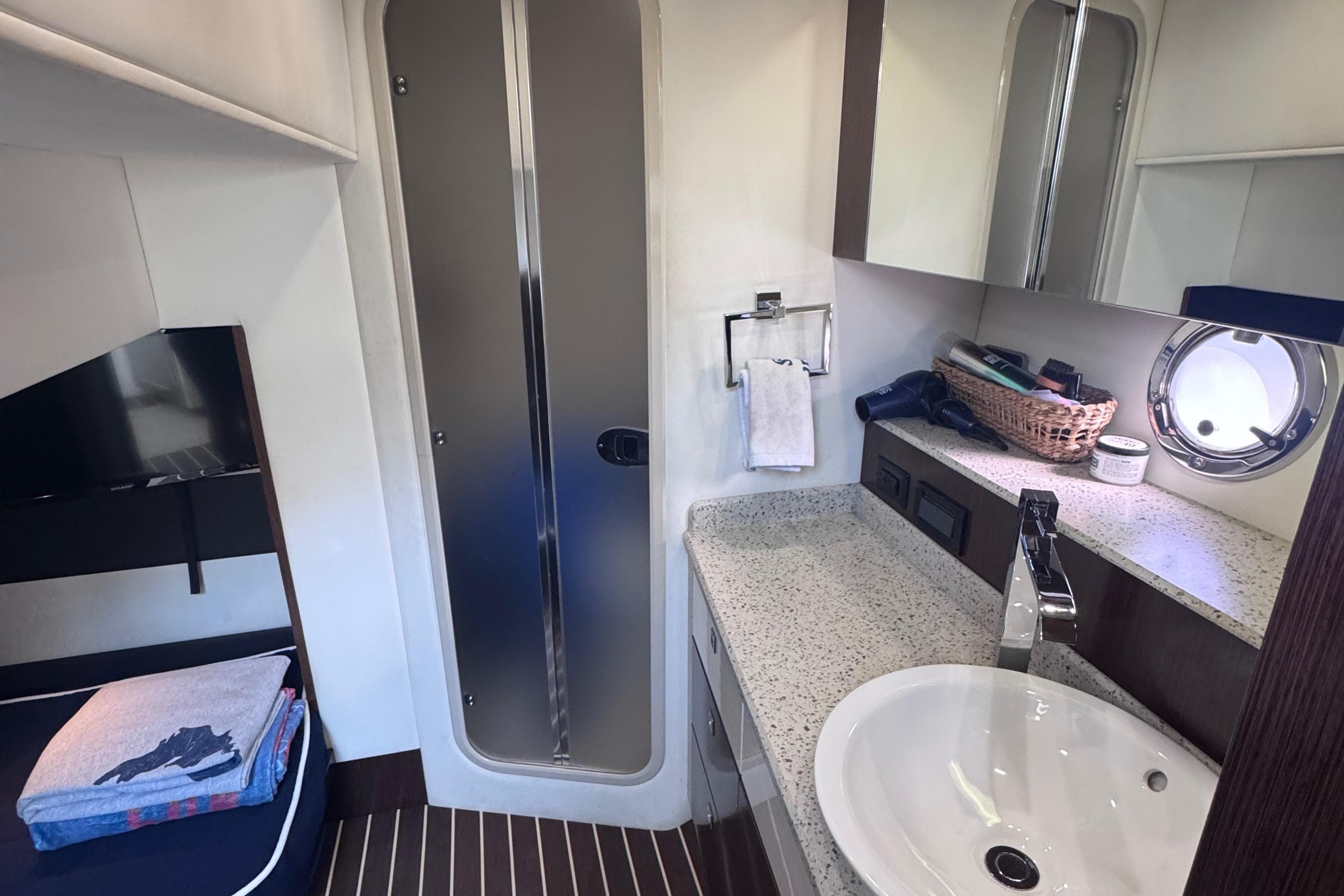Luxurious bathroom interior of 2012 Cruisers Yachts 41 Cantius with modern amenities.