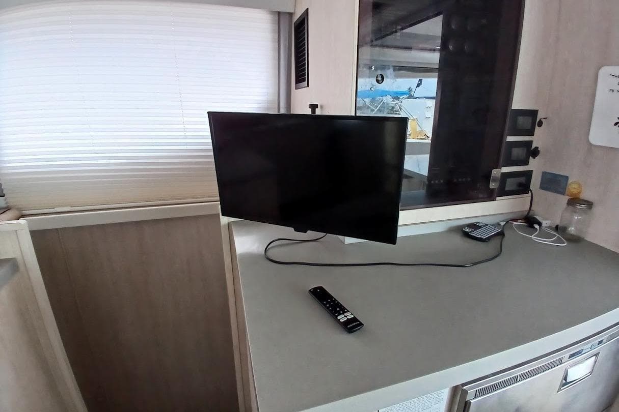 Television and remote on a countertop inside a 2019 Leopard 45 yacht interior.
