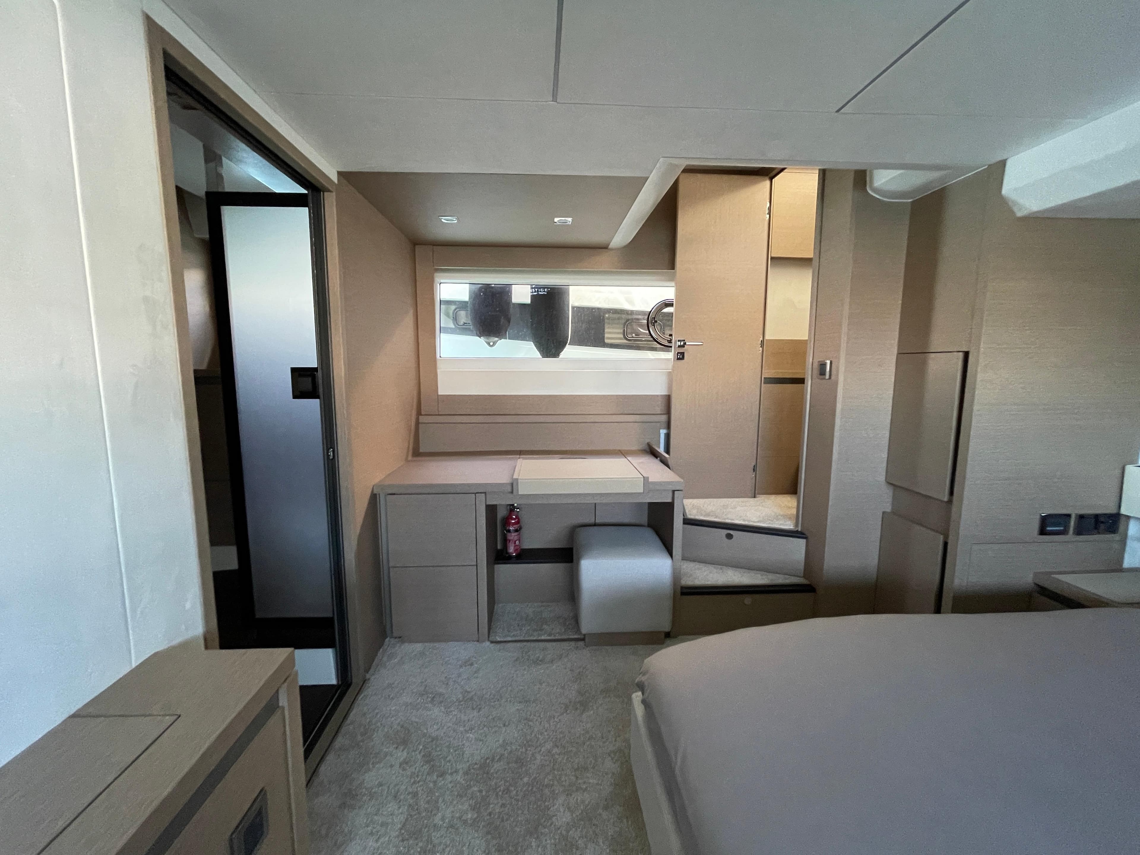 Luxurious interior of a 2020 Prestige 630 yacht cabin with modern furnishings.