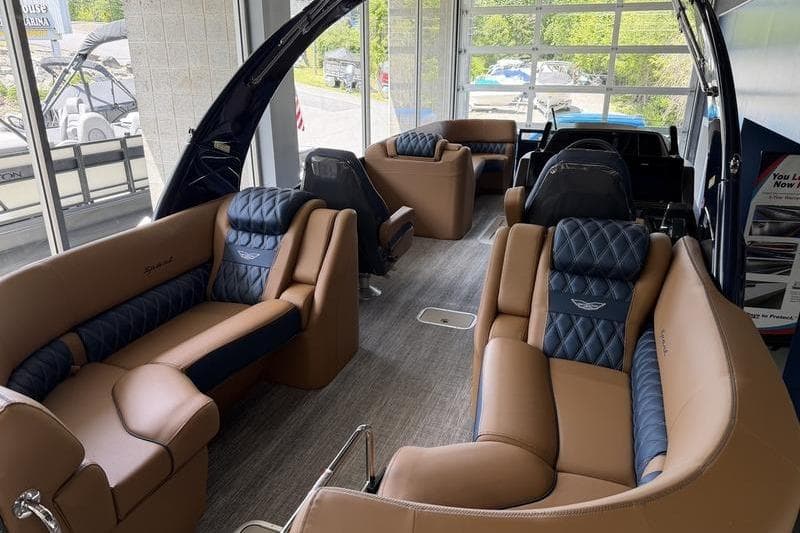 Luxurious interior of 2026 Bennington Q 25 QFBA pontoon boat with plush seating.
