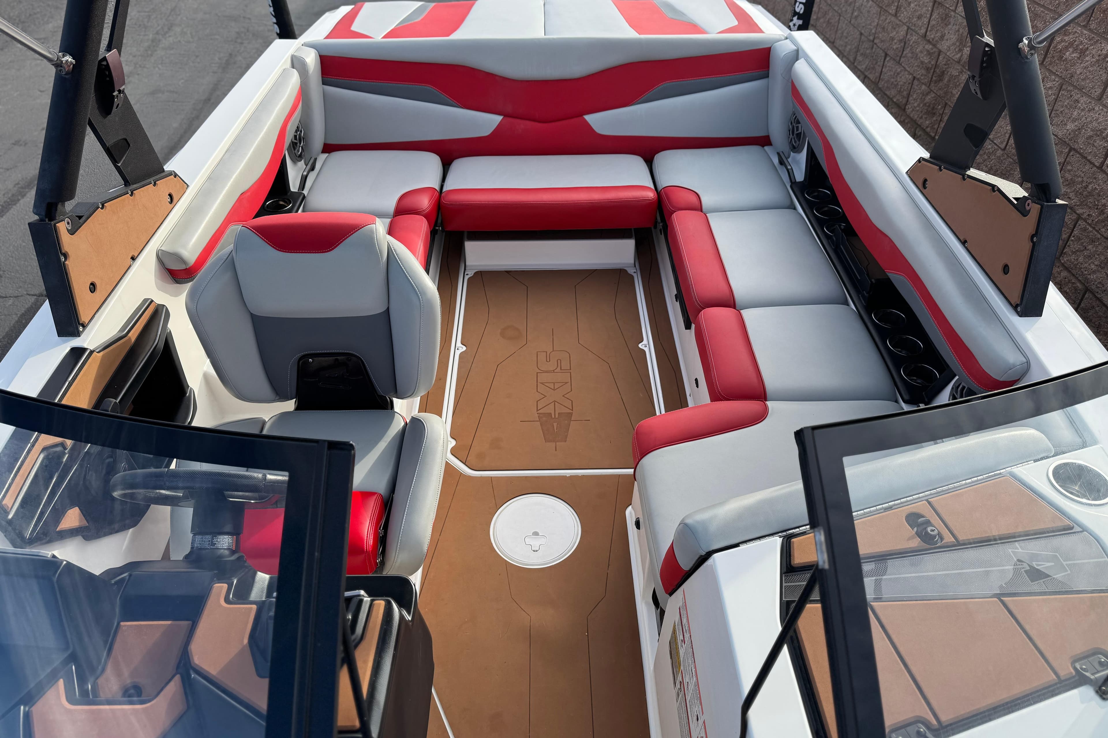 2023 Axis T220 boat interior with red and gray seating, modern design, and spacious layout.