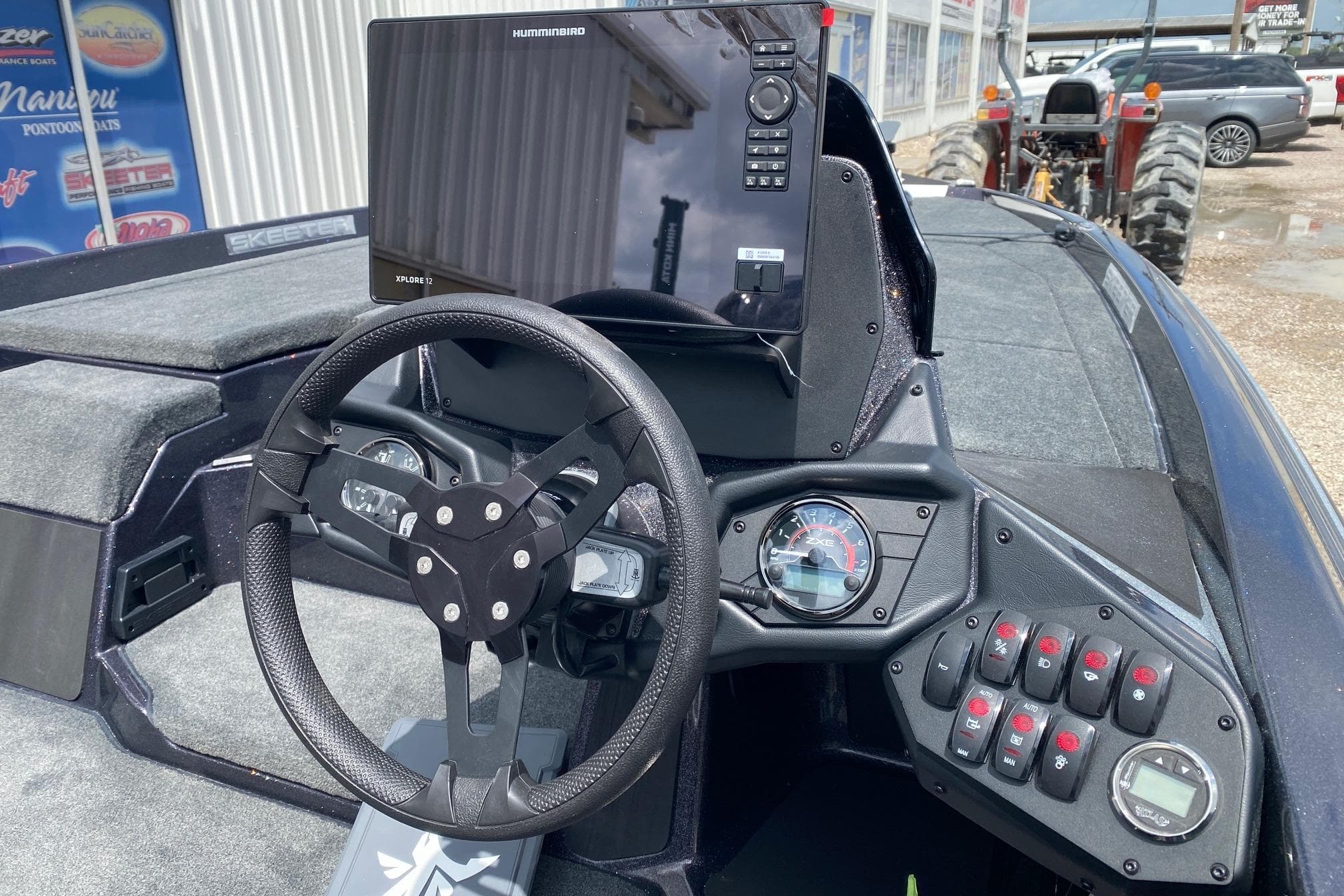 2026 Skeeter ZXE20 boat dashboard with steering wheel and Humminbird Xplore 12 display.