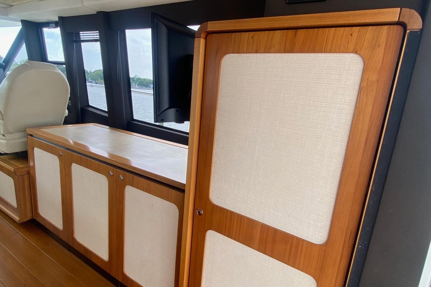 Interior of 2014 Azimut Magellano 50 yacht with wood and fabric paneling.